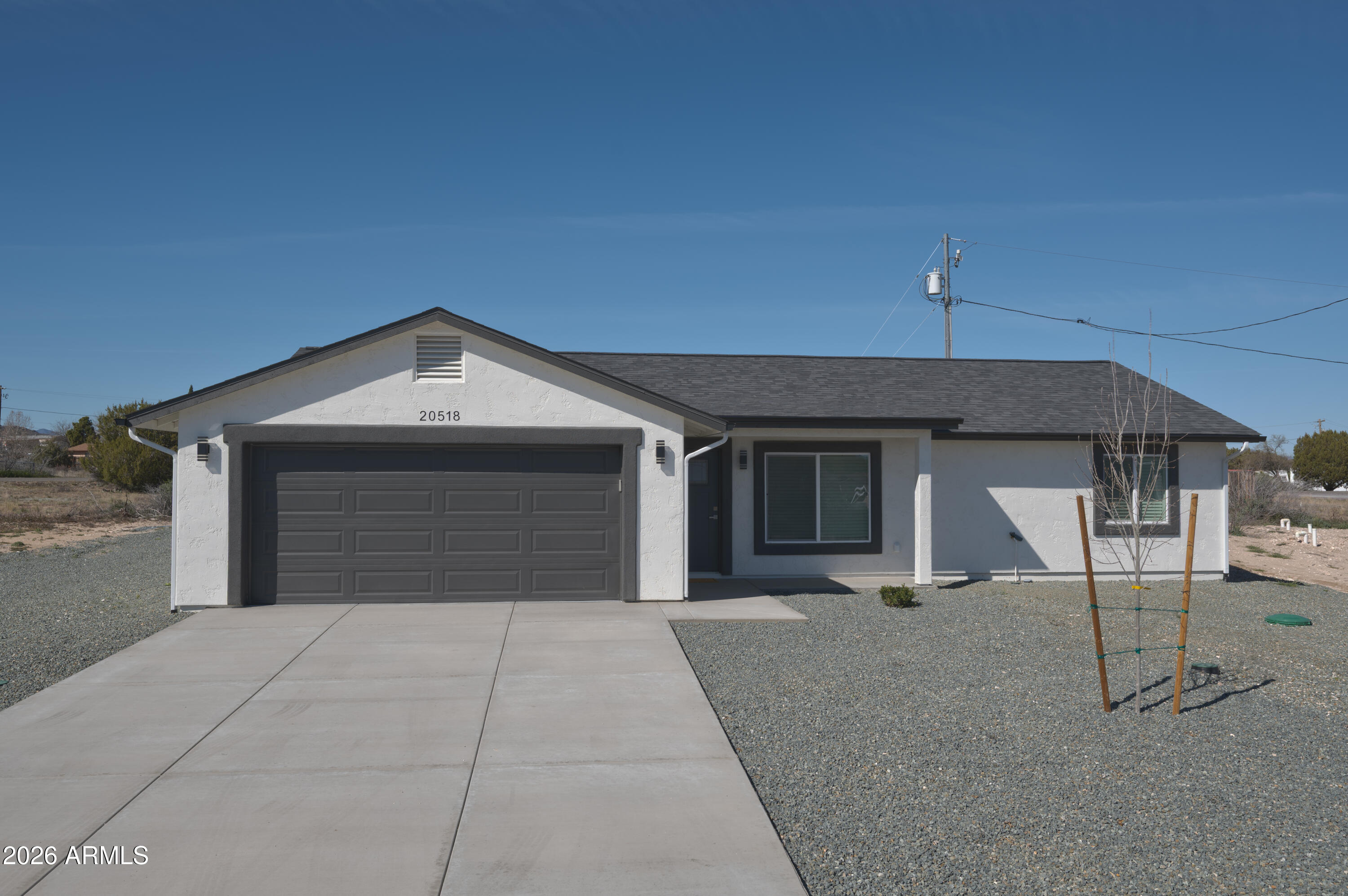 Stunning-NEW construction with modern finishes! This home features a spacious master suite with double vanity and walk-in closet, a chef's kitchen with quartz waterfall island, pot filler, and stainless-steel appliances. Includes a hot-water recirculating system, EV charging outlet (220V 50-amp), and RV access. Clean exterior design, low-maintenance landscaping, and a covered back patio complete this beautiful, move-in-ready home. This home was built to be a blessing -- come see it in person and experience the quality for yourself. We eagerly anticipate the opportunity to welcome you as the new owner to this exceptional property !