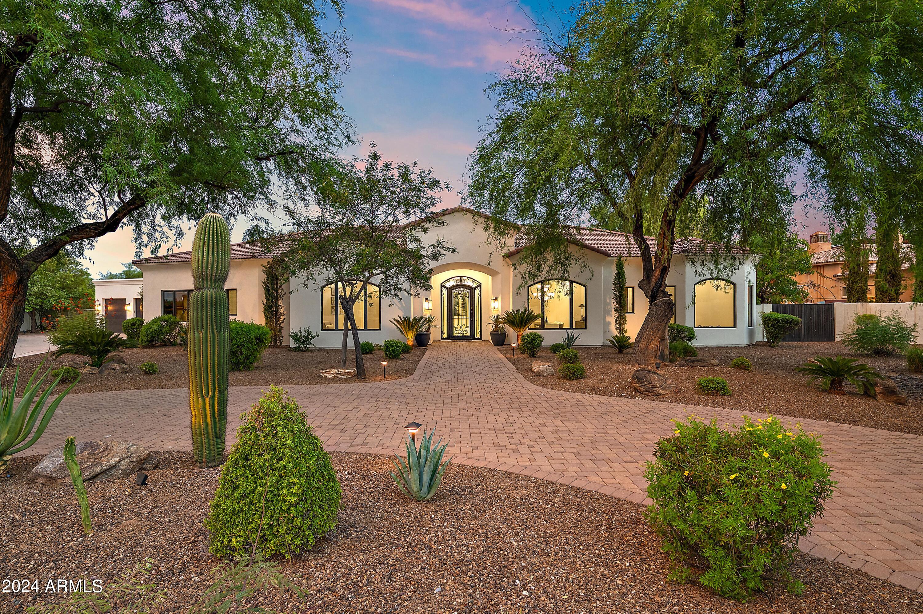A breathtaking Paradise Valley estate nestled in a serene cul-de-sac with a rear view of Mummy Mountain. The main house features 6200+/- sf with an additional 1200+/- sf of permitted and air-conditioned ADU for a grand total of 7400+/-sf. There is no better value at $608/sf. A highly requested floor plan with all bedrooms having their own bathroom, plus a hall powder room. A rare basement features a generous living area with an additional bedrm, bathrm, media room or gym. Ideal for guests or children seeking their own retreat.  Spacious 3-car garage with new epoxy floors, in-house vacuum & 12 storage cabinets. Rare & enormous 1200sf ADU with endless possibilities as a game room, workshop, guest house, gym, conference room or additional storage space. The expansive backyard is wider in the back, allowing for more backyard space than other homes. Don't miss 3 orange trees, a large shed, and room for a tennis court, in the huge side yard beyond the ADU. Backyard also accessible through double gates for RV parking. Kitchen features 2 breakfast bars, Subzero freezer and refrigerator, double ovens, 6 burner gas cooktop, walk-in pantry, 2 sinks & 2 dishwashers. Primary suite features 2 walk-in closets, a double-sided fireplace, jetted tub and double vanities. Recent upgrades include new interior and exterior paint, white Oak hardwood floors, quartz countertops, and new LED lighting. Don't miss this opportunity to own a slice of paradise in Paradise Valley. With its luxurious amenities and prime location, this is more than a home, it's a lifestyle waiting to be embraced. Discover your dream residence today!

Buyer to verify all facts and figures.