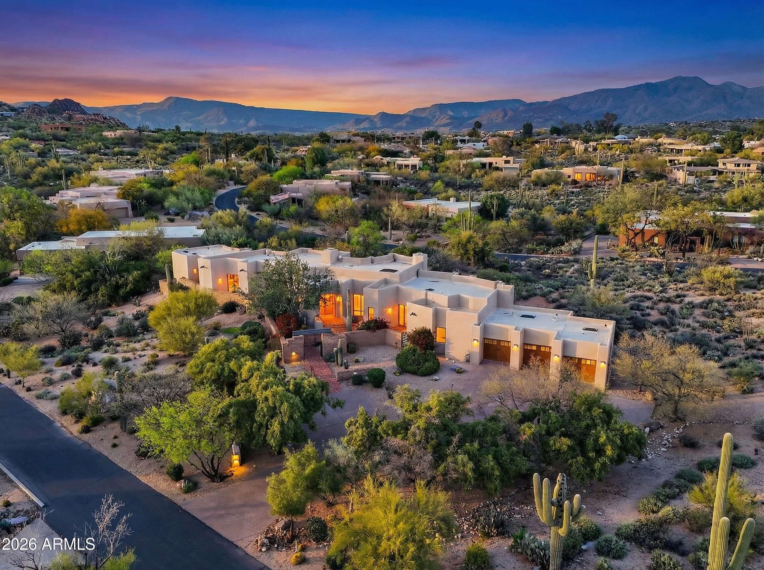 A rare opportunity to own a custom soft-contemporary estate designed by renowned architect Terry Kilbane, originally built as his personal residence. Recently refreshed, this architectural home blends timeless Southwestern character with refined modern living. Offering 3 bedrooms and 3.5 baths, including a built-in office with walk-in closet that easily serves as a fourth bedroom. Signature elements include exposed wood beams, dramatic ceiling lines, expansive skylights, and seamless indoor-outdoor living that captures the beauty of the Sonoran Desert. Set on two combined homesites backing to NAOS, the property offers exceptional privacy and sweeping desert views within the prestigious Boulders community--moments from world-class golf, hiking, dining, and North Scottsdale amenities.