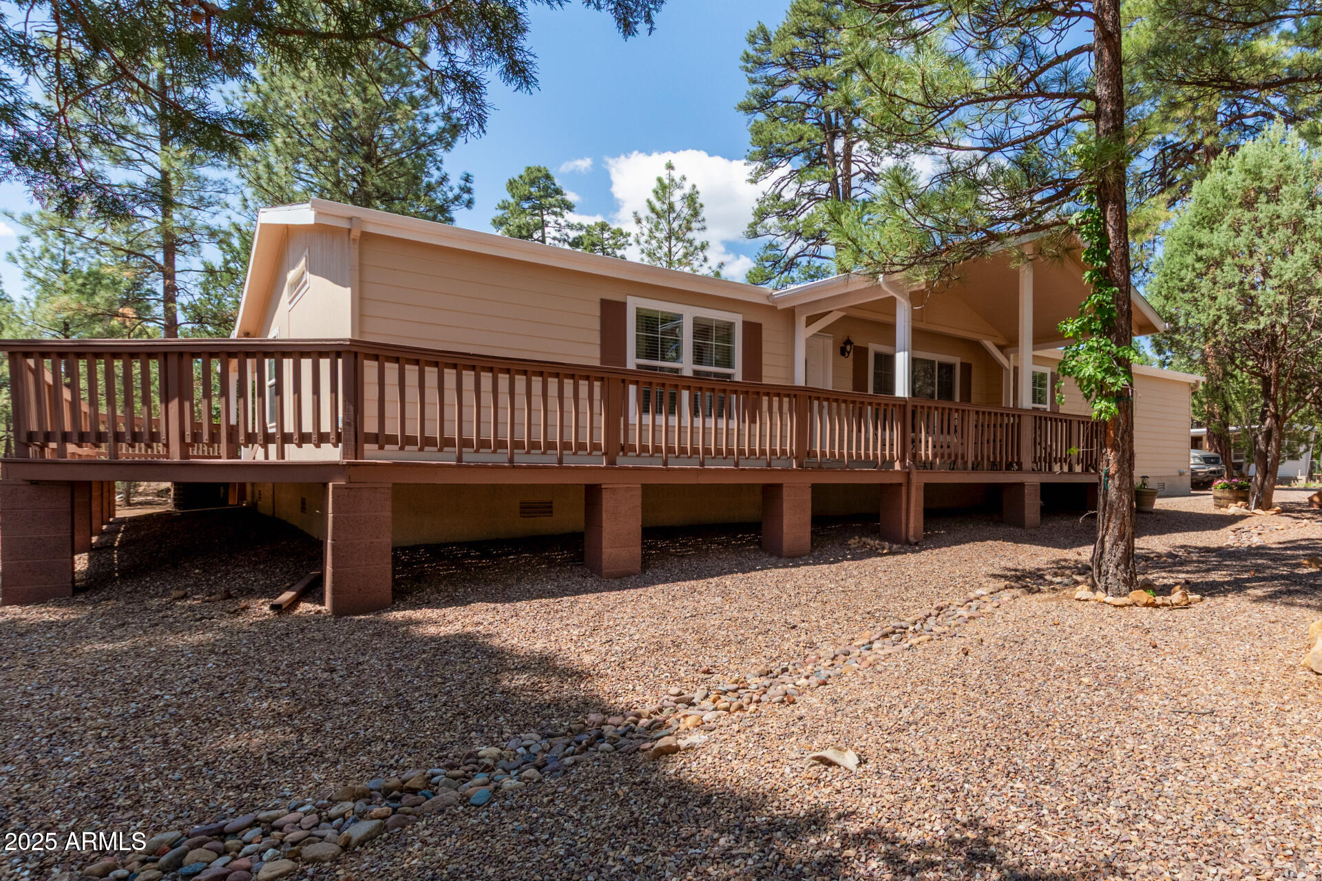 The proud original owners have lovingly maintained this property for years and are now ready to pass it on to someone new to enjoy and make their own. The primary manufactured home, secondary home, and RV home all can come fully furnished. Including furniture, curtains, smart TVs, decor, appliances, washer/dryer, and even kitchen essentials can all be included. This is a truly turn key, move-in-ready opportunity waiting for its next owner to enjoy from day one! Nestled on 1.82 scenic acres in beautiful Heber-Overgaard, this one-of-a-kind property offers well-maintained multi-residence property featuring a beautifully updated primary manufactured home, a 2-bedroom mobile home, and a fully equipped RV home. Main Home built in 2005 30' x 64' roof was replaced in 2024. Recently updated with new interior/exterior paint, granite bathroom counters, new toilets, faucets, dishwasher, water heater and more. Brand new washer and dryer installed for buyers convenience. Master bedroom features oversized master tub, separate shower and dual vanities. Enjoy outdoor living with a spacious Trex wrap-around deck and a charming front porch, perfect for relaxing or entertaining. The beautifully landscaped front and back yards are adorned with mature pine trees, lush plants, and well-maintained shrubs. Three storage sheds (two with new roofs), and a two-car garage with a working electric opener. Second 1959 Mobile Home 10' x 50'. Features 2 bedrooms, 1 bathroom with redwood deck, awnings, vinyl/carpet flooring, and furnished with beds, TV, couch, and microwave. Exterior was painted in 2023, roof coated in 2022. RV 1965 Home 32' x 8'. Includes a bedroom, kitchen, dinette, and full bath setup. Features laminate counters, microwave, and more. Recently painted with updated interior touch-ups. This unique property offers a rare combination of upgraded living spaces, versatile guest accommodations, and beautifully landscaped outdoor areas. Whether you're looking for a primary residence with additional units or a family retreat this one has it all, ready for you to move in and enjoy!