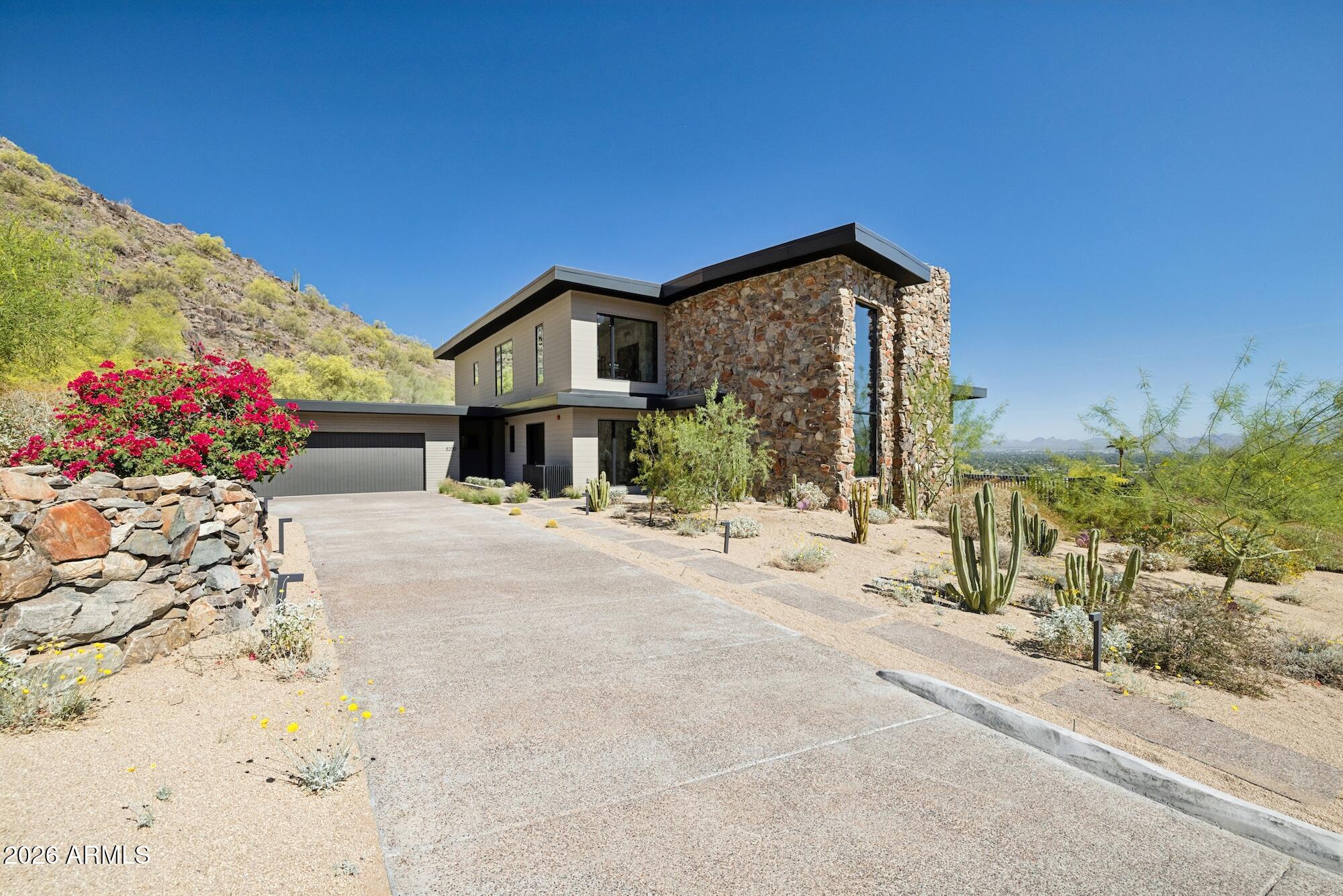 MOTIVATED SELLER. NOW PRICED AS ONE OF THE BEST OPPORTUNITIES IN SUNSET HILLS. $350K+ IN UPGRADES. NEVER LIVED IN.

Welcome to one of the most prestigious hillside settings in Paradise Valley, where elevated living meets breathtaking, unobstructed views. Positioned to capture sweeping 270 degree panoramas of Scottsdale, the McDowell Mountains, and Arizona's pristine high desert, this residence delivers the privacy, serenity, and exclusivity that define true hillside living. Living in Paradise Valley offers a lifestyle unlike anywhere else, quiet, elevated, and removed, yet just minutes from the best dining, shopping, golf, and resorts in Scottsdale and Phoenix. It's where privacy meets convenience, and every day feels like a retreat. Walls of glass create a seamless indoor outdoor experience, while an expansive view deck sets the stage for unforgettable sunrises, sunsets, and sparkling city lights. Inside, the chef's kitchen has been redesigned to enhance natural light and flow, featuring custom cabinetry, updated counter tops, and designer glass pendant lighting. Open concept living spaces are complemented by updated lighting, ceiling fans, and smart home features, creating a warm yet sophisticated atmosphere. The primary suite offers a private retreat, while bathrooms feature new vanities, fixtures, and custom closet systems. Technology upgrades include whole house audio, security, WiFi, and AV enhancements for modern living. Step outside to a resort style backyard with upgraded pool equipment, including heating and cooling capabilities for year round enjoyment. Extensively updated and move in ready, this home captures the essence of Paradise Valley hillside living. private, elevated, and truly exceptional.
