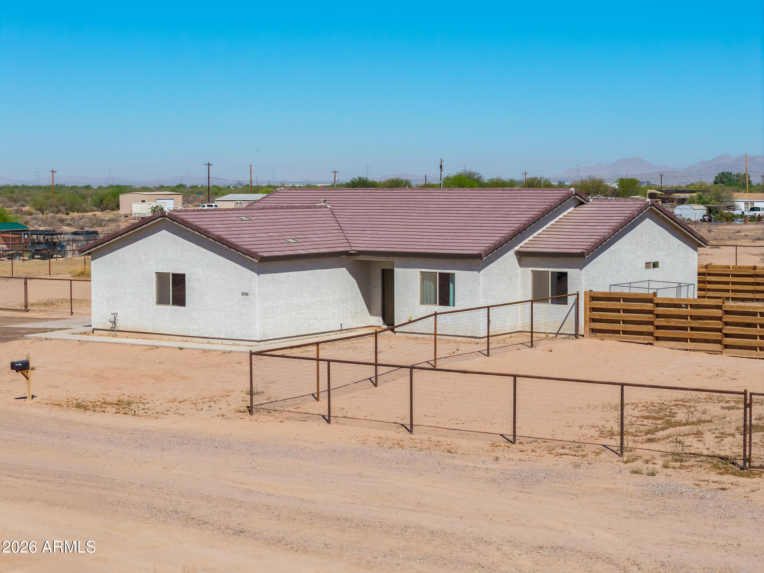 Built in 2023, this rare 4-bedroom, 2-bath horse property sits on 1.4 acres and offers space, style, and functionality. Features include an oversized garage, pipe fencing around the entire property, and a covered patio. Inside, enjoy tile flooring, expansive vaulted ceilings, and an open-concept floor plan. Quality 2x6 construction with spray foam insulation adds efficiency. The kitchen boasts quartz countertops, upgraded cabinetry, a large island, and stainless steel appliances. The guest bath offers a dual vanity and shower/tub combo. The spacious primary suite includes an extended vanity and updated walk-in shower. An oversized laundry room completes this exceptional home.