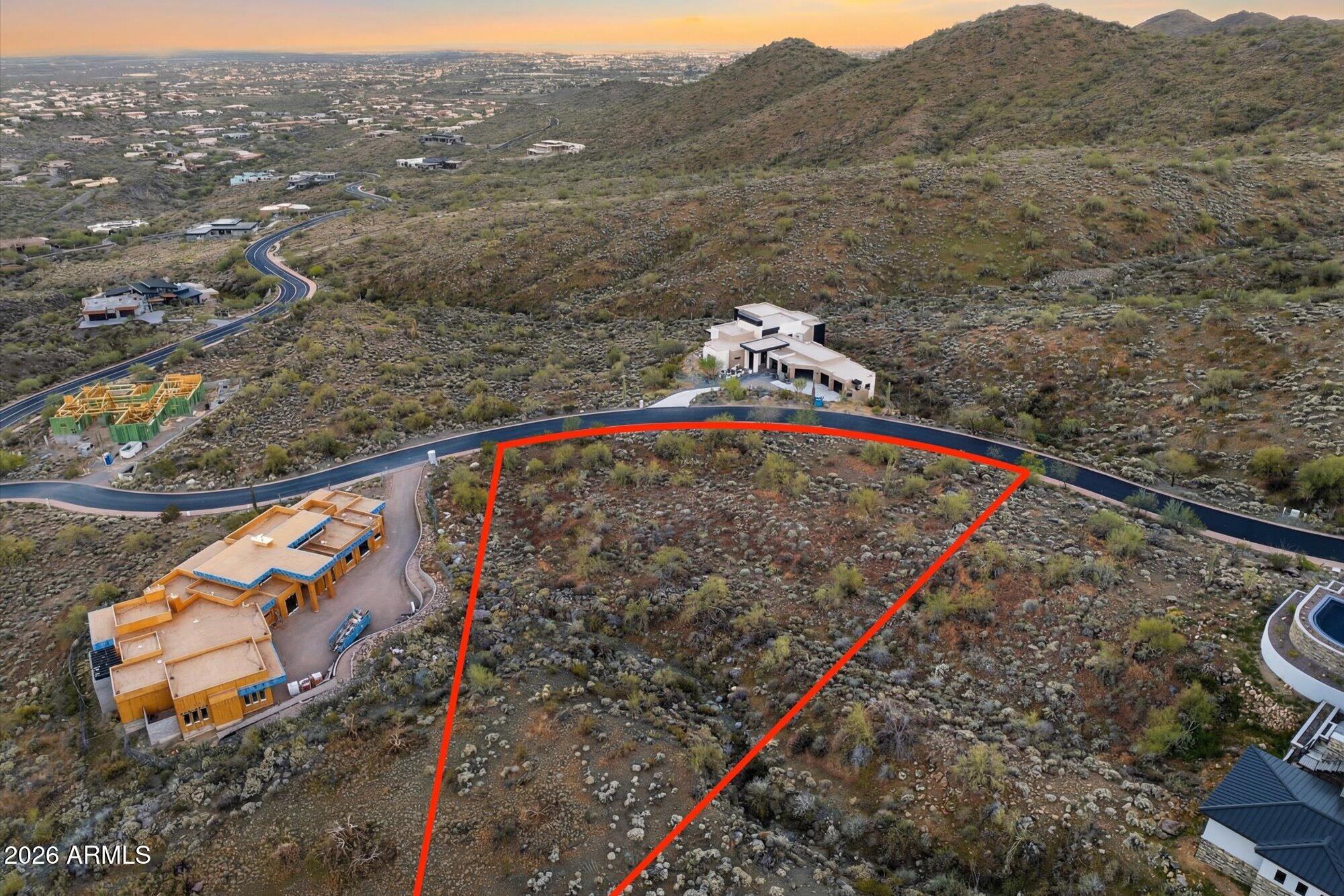 Build your dream home on this 1.21 acre home site in the exclusive guard gated community of Eagle's Nest in Fountain Hills. This premium lot offers incredible views of the iconic Four Peaks and sweeping 360 degree mountain vistas across the surrounding desert landscape. READY TO BUILD with full architectural and engineering plans by Tammen & Rose Architecture completed and HOA approved, saving significant time in the building process. Eagle's Nest is a prestigious luxury custom home community featuring estate sized homesites ranging from 1 to 5 acres set within more than 500 acres of pristine Sonoran Desert. Nestled in the foothills of the McDowell Mountains, the community is surrounded by protected mountain preserve land between Scottsdale and Fountain Hills offering exceptional privacy and breathtaking natural beauty. Outdoor enthusiasts will appreciate the nearby Dixie Mine Trailhead, providing access to over 40 miles of hiking, biking, and horseback riding trails within the 21,000 acre McDowell Mountain Regional Park.
