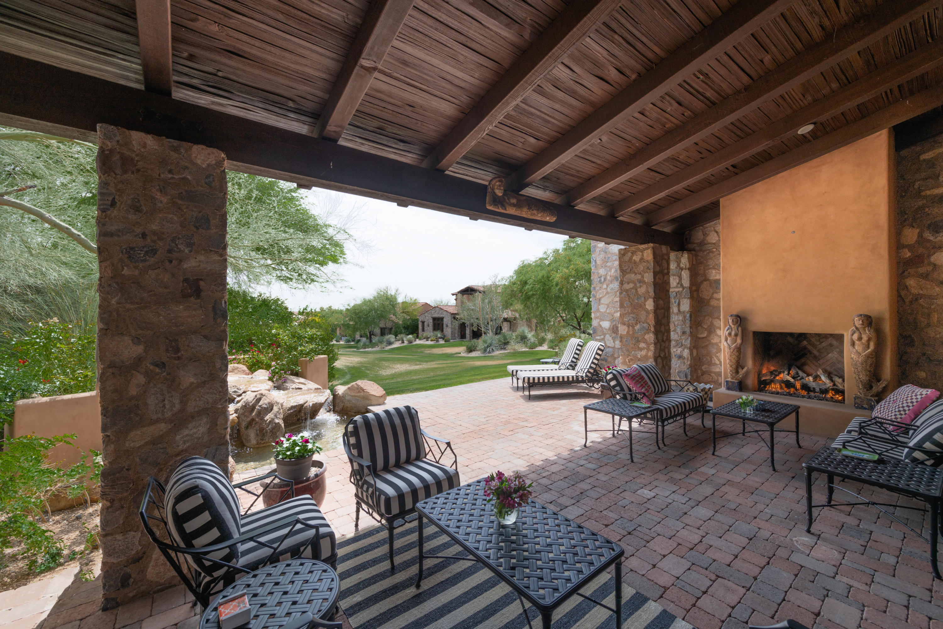 TURNKEY!  AN EXTRAORDINARY OPPORTUNITY!  Set behind the prestigious Silverleaf guard-gated community of Horseshoe Canyon rests this desirable Classic Casita on a charming lot backing to the quiet lush green in the center of an enclave of a few private residences.  The setting is beautiful, and as you are at convenient walking distance to the Club, with all its amenities, the ideal relaxed resort living is optimized.  The main characters of this warm and inviting home are prevalent already when you enter through the wrought iron gate into a cozy Mediterranean courtyard.  There the trinkling fountain, the colorful plants resting against the beautiful old world stonewall and tranquil seating area create a feeling of true vacation. The double front door opens to the airy great room with cathedral high ceilings,npolished wood floors, large fireplace, wet bar and wine cellar with picturesque views through the glass sliding wall to the back patio and the park.  The spacious floorplan shows the bright elegant yet functional chef's kitchen with Viking appliances, butler's pantry, utility room, a large marble center island/breakfast bar opening to the spacious dining area surrounded by large windows and French doors, with access to both the built in BBQ area and the terrace.   This fully appointed single level home has a beautiful light master bedroom suite leading to a fresh white marble bathroom, with lovely vanity area, French doors opening to a private zen patio for rejuvenation, and a vast functional his and hers master closet.  The office/media room with built-in bookshelves is an ideal space for working from home, if need be, and the two additional comfortable guest bedroom suites complete this flowing versatile floorplan.  The back yard does not disappoint with its shaded terrace, beautiful crisp waterfall and cozy fireplace, allowing that special enjoyment of the Arizona indoor/outdoor living at its best.  This timeless lock and leave home is an unique and exceptional example of tradition, charm and elegance perfect to enjoy with family and friends and benefitting todays relaxed yet demanding lifestyle. Welcome Home!