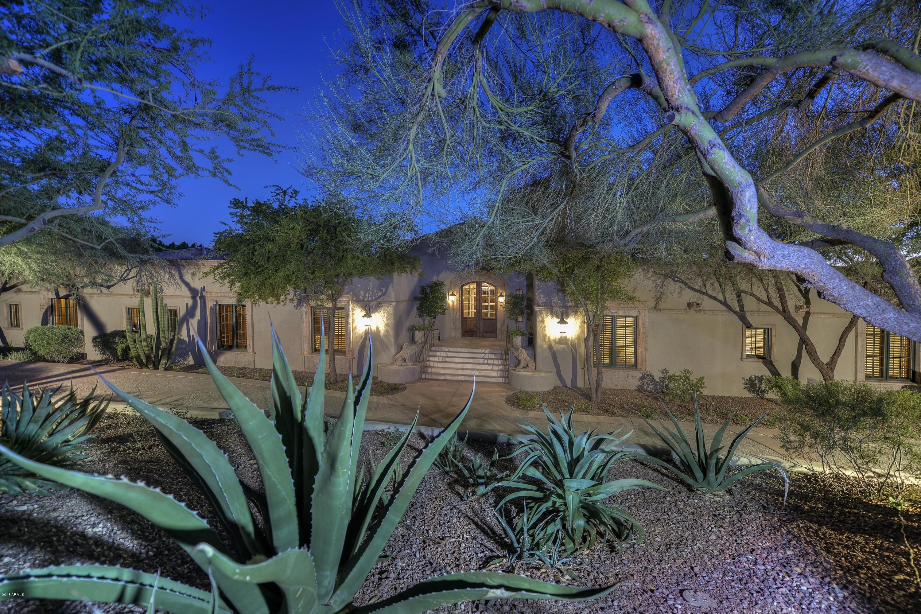 The essence of Paradise living, within walking distance of PVCC. Rare listing with extraordinary Camelback and city views. Recent renovation has resulted in a simple palette to frame both the view and the magnificent grounds of the home. Full guest quarters with private entrance, wood paneled game room with refrigerated wine cellar, private office, gourmet kitchen, Six fireplaces plus all bedrooms en-suite. Sunset on Camelback and city lights for magical entertaining on the extensive rear patio and lush grounds. Easy to preview; local real estate professionals claim this Residence will not last long; see MOTION VIDEO under Photo Tab.