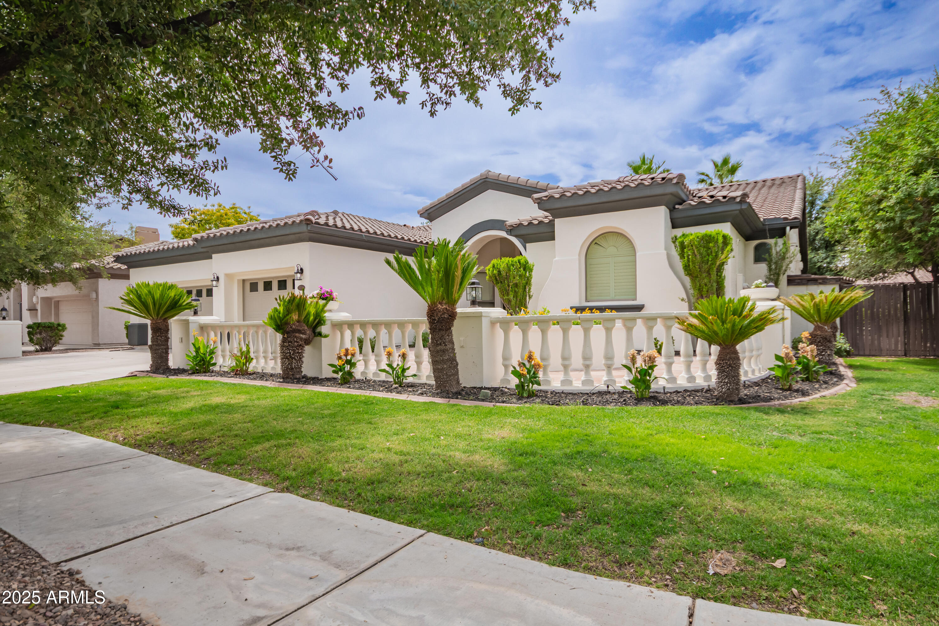 Welcome to 4711 E Buckboard Ct in Gilbert's award-winning Power Ranch! This beautifully remodeled home blends modern updates with timeless charm. Recent improvements include fresh interior and exterior paint, premium high-gloss tile flooring throughout, updated kitchen and bath cabinetry, new kitchen appliances, a stunning fireplace surround, and epoxy garage floors. The backyard is a private oasis featuring a rock wall water feature, fire pit, jetted hot tub, covered patio, iron gates, and low-maintenance landscaping. Enjoy an expansive private side patio adjacent to 15,000+ sq ft of shaded community green space with mature trees and a picnic area, creating the feel of a second backyard. Residents enjoy Power Ranch's exceptional amenities, including pools, lakes, parks, trails, sports cou rts, clubhouses, and year-round community events.