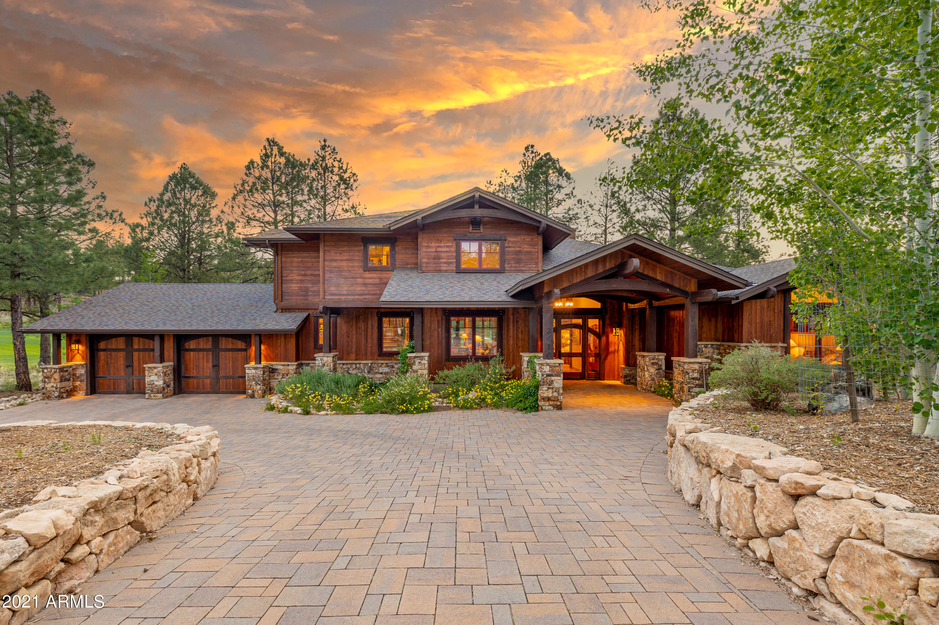 Perfection in the Pines.  The very best homesite within the private golf community of Pine Canyon, Flagstaff.  The home was built by Builder Showcase, the most prestigious builder in Northern Arizona.
Professional designed lush landscape surrounds the homesite in the quiet cul-de-sac with paver driveway and three-car garage and additional space for exterior parking.  The entry features a glass door that leads you into a heavenly view of the water, golf, and endless tall pines!  
On the main level, you have an entertainer's dream of soaring ceilings, endless glass, and cozy great room with floor to ceiling gas fireplace!  The main level features a guest en suite, media room, and a half bath.
The gourmet kitchen encompasses stainless steel appliances, wolf-subzero, breakfast bar, and dini room all perched over the lake and panoramic golf!  The patios are extremely private, provide an electronic screen, built-in bbq, heaters, and exterior television. 
Upstairs you have two oversized bedrooms, bathroom, loft, and balcony capturing timeless serenity! Truly a rare opportunity to capture the most coveted location in Pine Canyon.  Walking distance to the clubhouse, walking distance to park, national forest trail system!  There is not higher quality, location, and home than 2610 Bueno Vista.