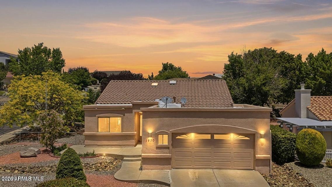 Fabulous home in the Cliff Rose subdivision. The location offers stunning mountain views in a central Prescott neighborhood. The light filled living space includes a kitchen and dining area with convenient buffet space. Spacious living room highlights the lower transom windows, gas fireplace, and slider access to the covered patio. Split bedroom floorplan features a primary bedroom suite with a full bathroom, including a garden tub, walk in shower and a walk-in closet. Two guest bedrooms share a full bathroom. The yard is beautifully landscaped, and the back yard has a small dog run. The laundry room leads to the 2 car garage with added storage cabinets. Clean and well maintained, this property is ready for your vision. Close to lakes, hiking, medical, shopping and downtown Prescott. The subdivision has an RV parking area, subject to availability.