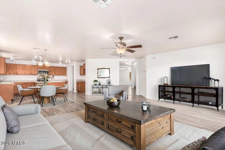 Get ready to fall in love with this remodeled 2-story beauty featuring a 3-car garage! Enjoy movie nights or cozy gatherings in the inviting living room, or spread out in the spacious family room. The kitchen is a chef's delight with SS appliances, wood cabinets, plenty of counter space, a walk-in pantry, and a center island perfect for meal prep or morning coffee. The main bedroom promises peaceful nights with a chic ensuite boasting dual sinks, a soaking tub, and a walk-in closet. Need extra space? The loft is ideal for a media hub or play zone! The serene backyard with a covered patio offers endless possibilities even room for a pool! Don't let this one get away!