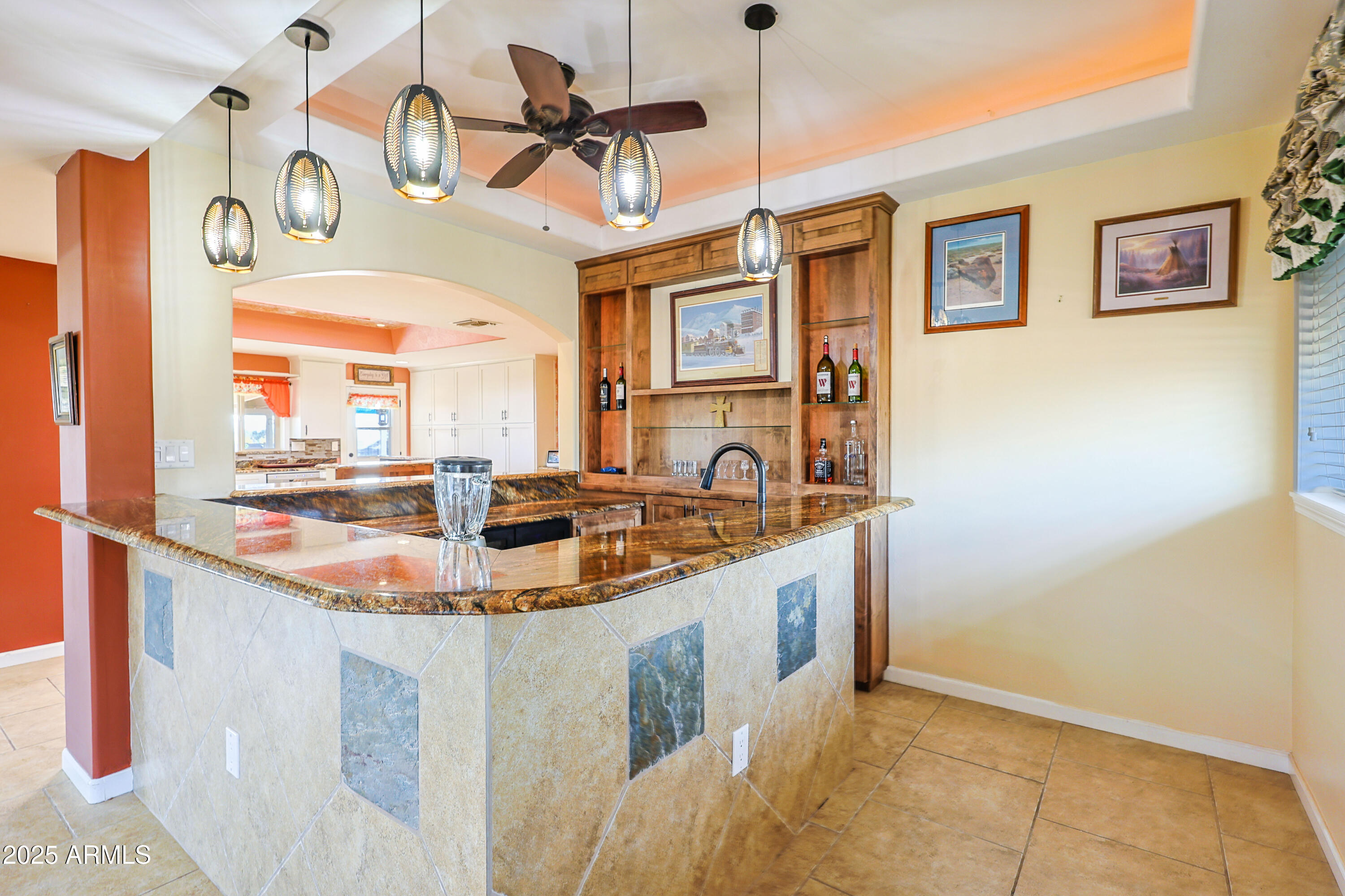 Ranch style brick home on 2.2 acres, recently remodeled throughout high-end finishes and custom features. Kitchen offers custom cabinetry with pull-out sliding shelves, granite countertops, touch faucets, skylights, and premium appliances. All tile flooring. Designed for entertaining, the open concept family room/dining area center around a beautiful oversized electric fireplace/heater, custom built wet bar complete with ice maker, 2 wine coolers and sink. Skylights in kitchen, hallway, and primary suite provide abundant natural light. Pelican whole house water filtration system. Large front yard is currently being enhanced with new landscaping. Detached 2+ car oversize insulated garage, Large covered patio, 4 person hot tub under pergola, fire pit, 3 sheds, greenhouse. This move-in-ready property combines privacy, comfort, functionality, and outdoor living. Spacious lot with unimaginable potential. Oh, and did I mention the gorgeus views of the Huachuca Mountains? Please check out property features indoor/outdoor in the documents section.