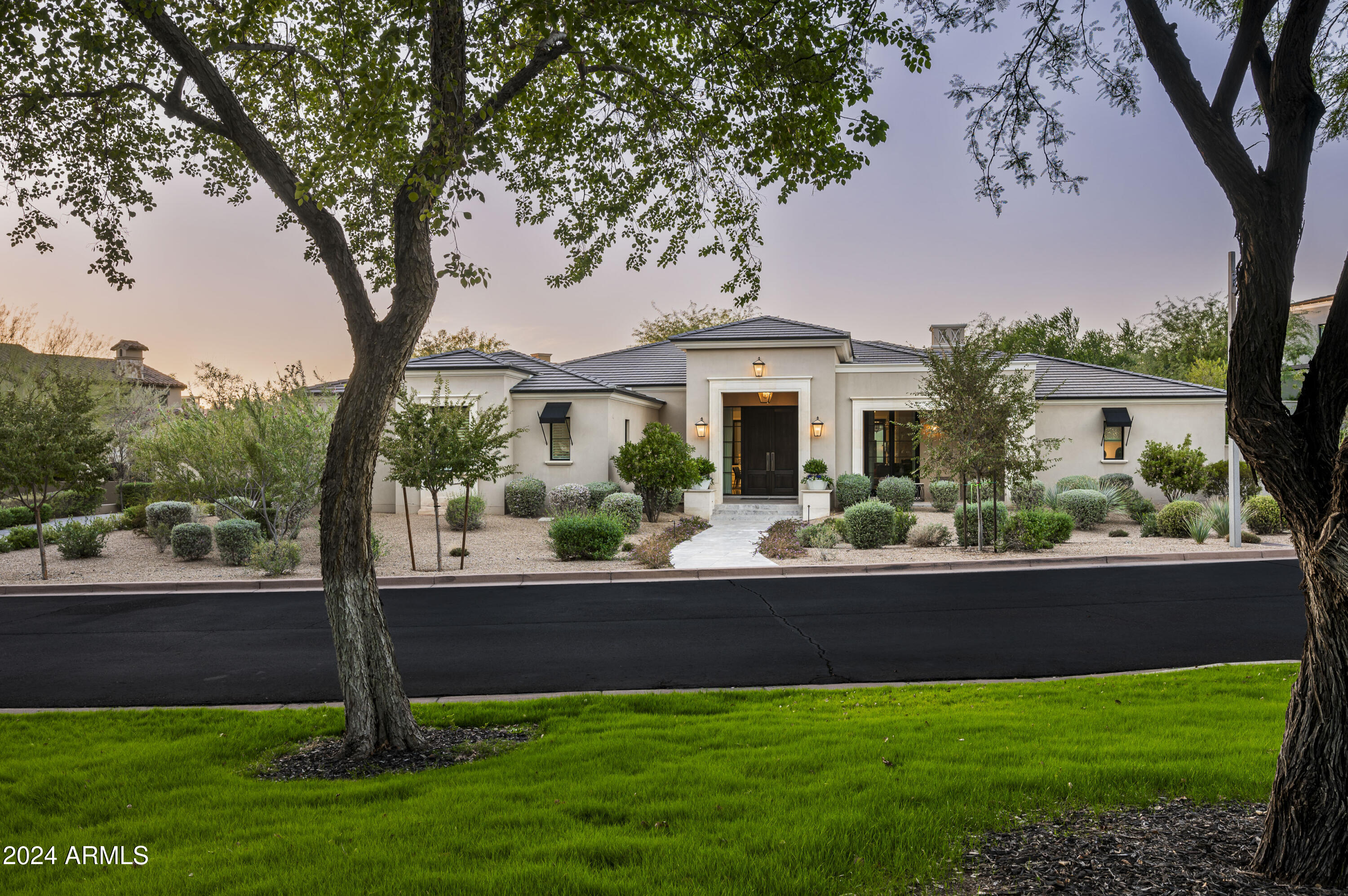 Nestled in the serene enclave of Arcadia at Silverleaf, this exquisite custom 4415 square foot, single-level residence combines the size, style and quality in such high demand today. Designed and built by Dale Gardon and Salcito Custom Homes, the quality of construction and finishes are exactly what you'd expect, providing both modern comfort and timeless elegance.  It's park location and curb appeal set the stage and the lush landscaping enhances and preserves the total privacy.  Enter the home through a large foyer into a fantastic great room filled with an abundance of natural light. A large pocket door system leads to an expansive covered patio, pool, ramada and BBQ center, creating an ideal space for indoor-outdoor living, perfect for gatherings of all kinds.
