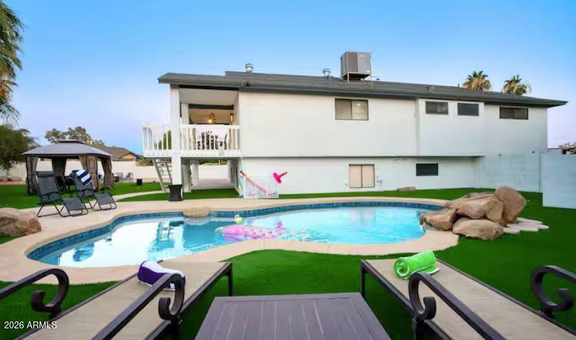 Trilevel Home with 6 bedrooms. Modern spacious home designed for entertainment and fun. Large private lot with plenty of parking. Large backyard with a resort style pool, artificial grass, barbeque, patio, and a game room. RV Hook ups added sewer line, electricity ready to go. Coming soon.