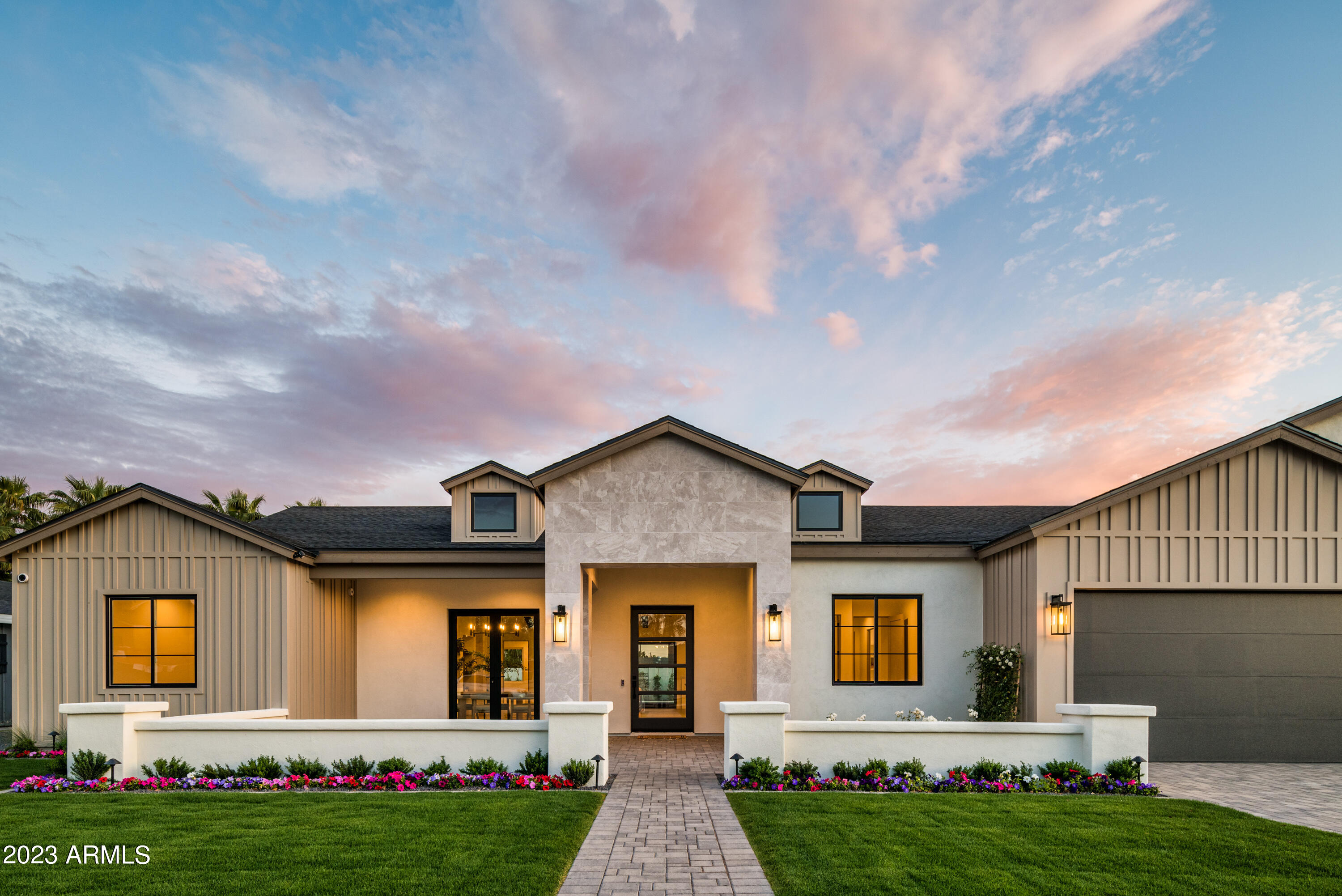 STUNNING MODERN ARCADIA FARMHOUSE BY MILCO DEVELOPMENT. Welcome home to high-quality new construction boasting an array of sleek finishes, a functional open floor plan, pre-wired for smart home features, five ensuite bedrooms, vaulted ceiling in the great room, and 10' ceilings throughout the rest of the home. From the moment you stand in the grand foyer, you will feel right at home. Stepping into the living space, a wall of windows will shower you with natural light and views of your beautifully landscaped backyard with sparkling pool. The highly equipped chef's kitchen is ready for entertaining with high-end appliances, a spacious butler's pantry, under-counter lighting, and a massive 10' island.