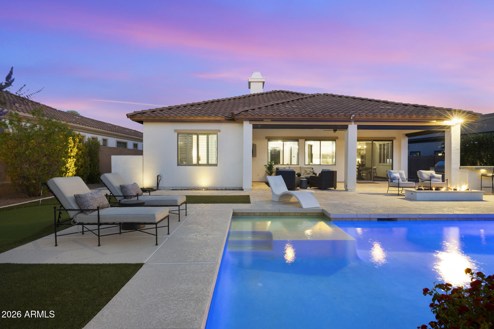 Discover refined desert living in this exceptional Toll Brothers home, nestled on an oversized lot in the coveted community of Cave Creek, Arizona, where breathtaking mountain views are simply part of everyday life.

A striking Mediterranean-style facade, desert landscaping, and an elegant arched iron entry door set the tone from the moment you arrive. Spanning three bedrooms plus a versatile den and 2.5 bathrooms, this thoughtfully designed split floor plan home showcases an impressive level of craftsmanship at every turn. Rich wood flooring and plush carpet flow seamlessly beneath soaring ceilings and abundant natural light, while plantation shutters and custom window treatments frame every view with effortless style. The expansive great room anchors the home with a stacked stone gas fireplace and custom built-in entertainment center, an ideal setting for relaxed evenings and weekend entertaining. The open-concept kitchen and family room are a chef's delight, featuring a dramatic two-tone design with white shaker cabinetry, a bold dark island topped with stunning marble countertops, herringbone marble backsplash, globe pendant lighting with brass accents, premium KitchenAid stainless steel appliances, gas cooktop, wine refrigerator, and a welcoming eat-in dining space.

The primary suite offers a true retreat, featuring a barn door entry, spa-inspired bath with double vanities, soaking tub, resort-style walk-in shower, and a spacious walk-in closet with custom shelving. 

Step outside to a backyard built for the ultimate Arizona lifestyle. The extended travertine patio with motorized electric blinds and a covered outdoor living area complete with ceiling fan and mounted TV flows seamlessly to the heated pool with tanning ledge, surrounded by lush professional landscaping, artificial turf, a putting green, and a built-in gas fire pit perfect for cool desert evenings. The fully equipped outdoor kitchen features a built-in gas grill, granite countertops, and beverage cooler, all set against sweeping mountain views that make Cave Creek so special.

Located minutes from golf courses, dining, shopping, and easy freeway access, this is the Arizona dream home you've been waiting for.
