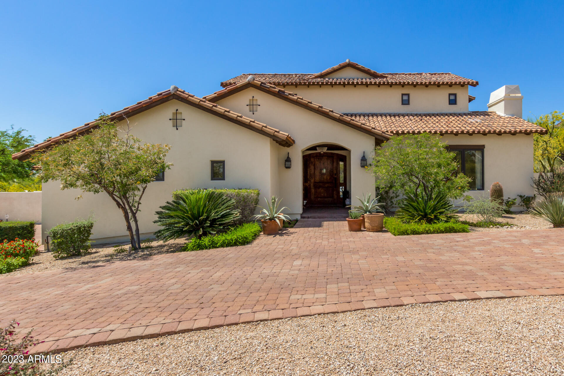 Beautifully renovated 2015 Modern Spanish Colonial with extraordinary construction, design & finishes.  This amazing home is set on just under an acre on Camelback's south slope. Majestic mountain and city views surround the home. Inside, discover an exquisite blend of tile & wood flooring, lighting & plumbing fixtures. Multiple entries/exits, & exposed wood beams. The formal dining has access to the wine cellar! Master plus one bedroom on main level & 3 upstairs with add'l family/game room with walk behind wet bar & large patio overlooking backyard and city view.  The heart of the home is the lovely kitchen with marble counters and huge island. Steam shower, California Closets  & custom window treatments thru-out. See extensive list of improvements. Elegant home.