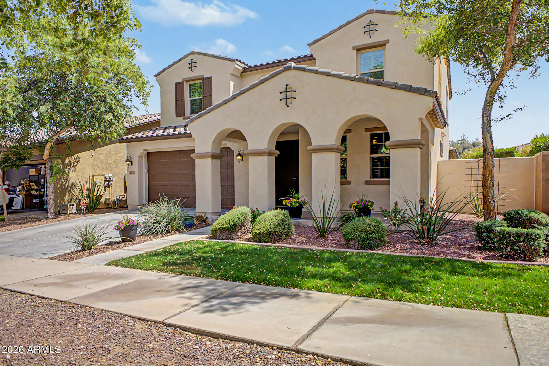 POOLSIDE LUXURY IN VERRADO'S HERITAGE DISTRICT. Discover this rare Maracay Candlewood model, a 3,300 sq ft modern ranch estate featuring a private resort-style pool, 3-car garage, and a highly coveted ''two-down'' floor plan.
Designed for both grand-scale entertainment and a tranquil desert lifestyle, the interior boasts a magnificent great room with soaring ceilings and massive architectural wood beams. The chef's kitchen serves as the social heart of the home, equipped with thick-slab granite countertops, a designer tile backsplash, and an oversized center island.
The main-floor primary suite provides a secluded retreat, complemented by a second full bedroom and bathroom on the first level, offering ultimate flexibility. Step outside to your private oasis featuring professional hardscaping, lush desert plantings, and a deep covered patio--perfect for watching the Arizona sunsets.

Located in the premier Heritage District, you are steps from the Heritage Swim Park, Verrado Golf Club, and 21+ miles of hiking and biking trails. Enjoy a quick golf cart ride to Main Street dining or the upcoming Verrado Marketplace. This property perfectly balances architectural drama with small-town charm, nestled in the heart of White Tank Mountains.