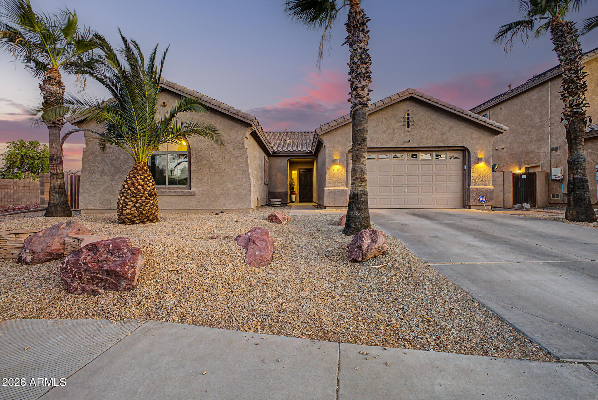 Look no more! This beautiful residence with POOL in Dysart Ranch is the one! Offering 3 beds + den, 2 baths, 3-car tandem garage, RV gate, and a low-care landscape. Discover a fabulous interior showcasing tall ceilings, tons of natural light, neutral palette, tons of natural light, and wood-look & stone tile flooring in all the right places. Great floor plan featuring a large living & dining room combo, and a separate family room w/sliding doors to the back! The impeccable kitchen boasts SS appliances, granite counters, recessed lighting, ample wood cabinetry, a pantry, a center island, a breakfast bar, and an additional eating area. The versatile den can be an office or extra bedroom as well! The large main bedroom has an ensuite with two vanities, separate tub/shower, & a walk-in closet. The true showstopper is the spacious backyard oasis, thoughtfully designed for effortless outdoor living and entertaining! Unwind beneath the covered patio or gazebo, enjoy the tastefully crafted paver hardscape & lush artificial turf, and soak in the relaxing hot tub or take a refreshing dip in the sparkling pool - all creating the perfect setting for year-round enjoyment. Plus SOLAR PANELS!! No neighbors behind, adding extra privacy. What's not to like? Make this gem yours!