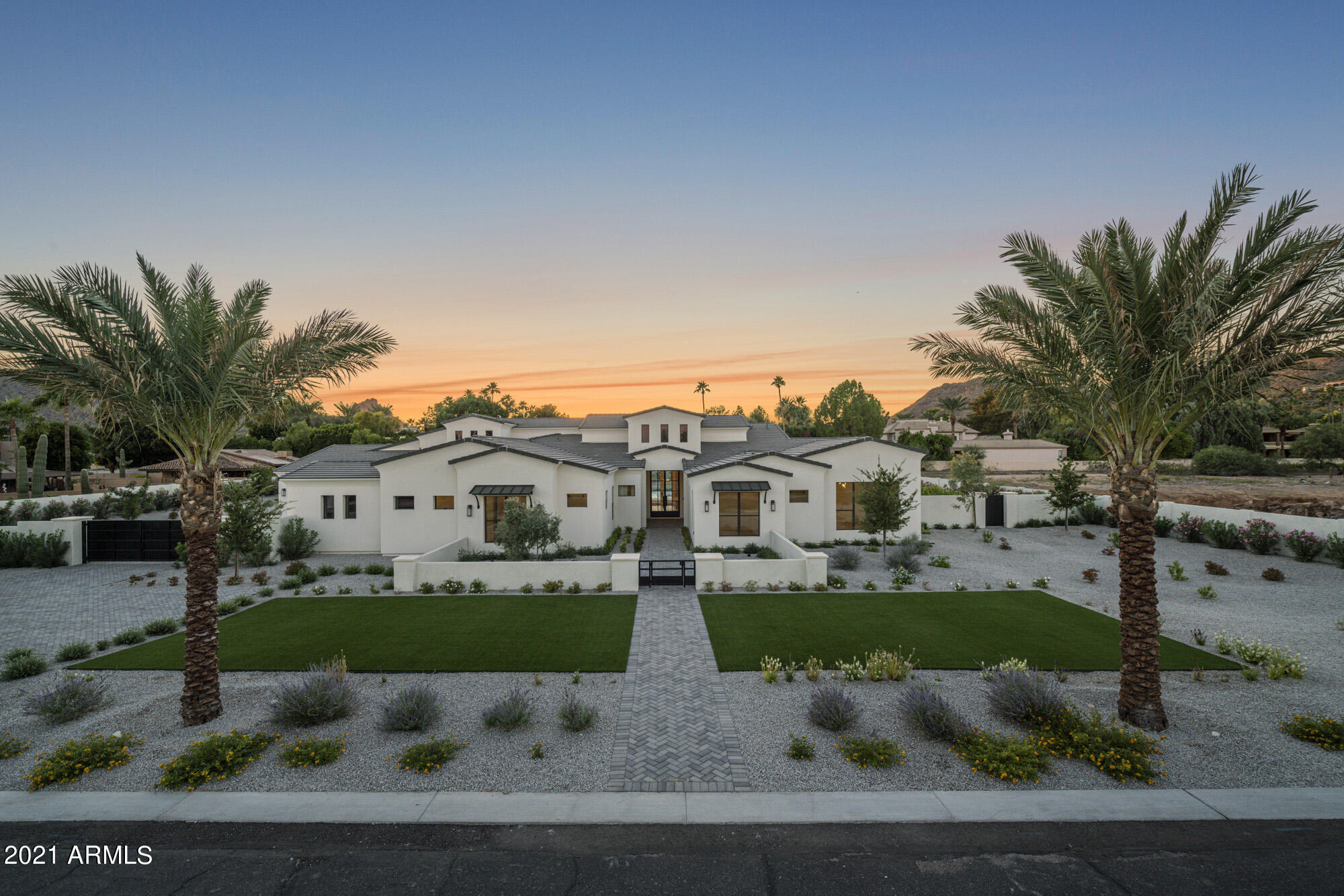 New construction luxury custom home. Find your own sanctuary tucked away in a private gated retreat and nestled on an acre lot, featuring stunning views of both Camelback and Mummy Mountains. Located in the heart of Paradise Valley, you will be walking distance to The Ritz Carlton and downtown PV. 6 Bedrooms, 5 and a half bathrooms, 5 car garage w/ electric car hook ups, a spacious game room & an attached casita. As you walk through the home, you will be captivated by the meticulously crafted details including designer light fixtures (Restoration Hardware), Quartzite countertops & contemporary InfintiFire fireplaces. Marble Mosaic Flooring, Provenza Wood Flooring. Wet Bar w/ SubZero wine cooler, Asko dishwasher, beverage center & ice maker... see supplement Retractable sliding doors from the great room will open you up to your very own backyard oasis, featuring an outdoor BBQ Kitchen, a Self Cleaning  Automated Pool and Heated Spa featuring LED Pool/Spa lights and deck jets.