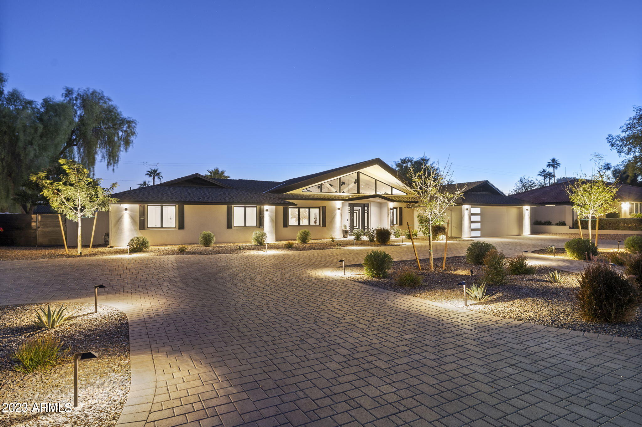 This meticulously remodeled Paradise Valley estate embodies a harmonious blend of modern comfort and timeless elegance, providing an exceptional level of luxury living. Embrace this rare opportunity to own a beautifully renovated home in one of the most sought-after locations in Paradise Valley. Five bedrooms offering comfort and style. 4.5 bathrooms exuding elegance and functionality with exquisite fixtures and fine materials. Four fireplaces to add beauty and coziness. Open-concept layout with an abundance of natural light. A gourmet chef's dream with top-of-the-line appliances, high-end cabinetry, and premium countertops. Well thought through interior showcasing the finest materials and superior attention to detail. Resort-style sparkling pool perfect for relaxation and entertaining. Massive douglas fir #1 rough sawn beams. Top of the line appliances include 48'' Wolf range, Wolf warming drawer, 24'' Sharp microwave drawer, 42'' built-in Kitchenaid refrigerator, Kitchenaid dishwasher, LG washer & dryer. state of the art HVAC Mitsubishi/TRANE inverter split system.
Smart Home Integration adds state-of-the-art technology for security and convenience. Quality craftsmanship at a 5 Star location nestled in the coveted Paradise Valley area with views of Camelback Mountain. This location offers convenience, privacy, and easy access to upscale shopping, fine dining, entertainment options, medical facilities, excellent schools, and iconic Paradise Valley and Scottsdale resorts and venues.