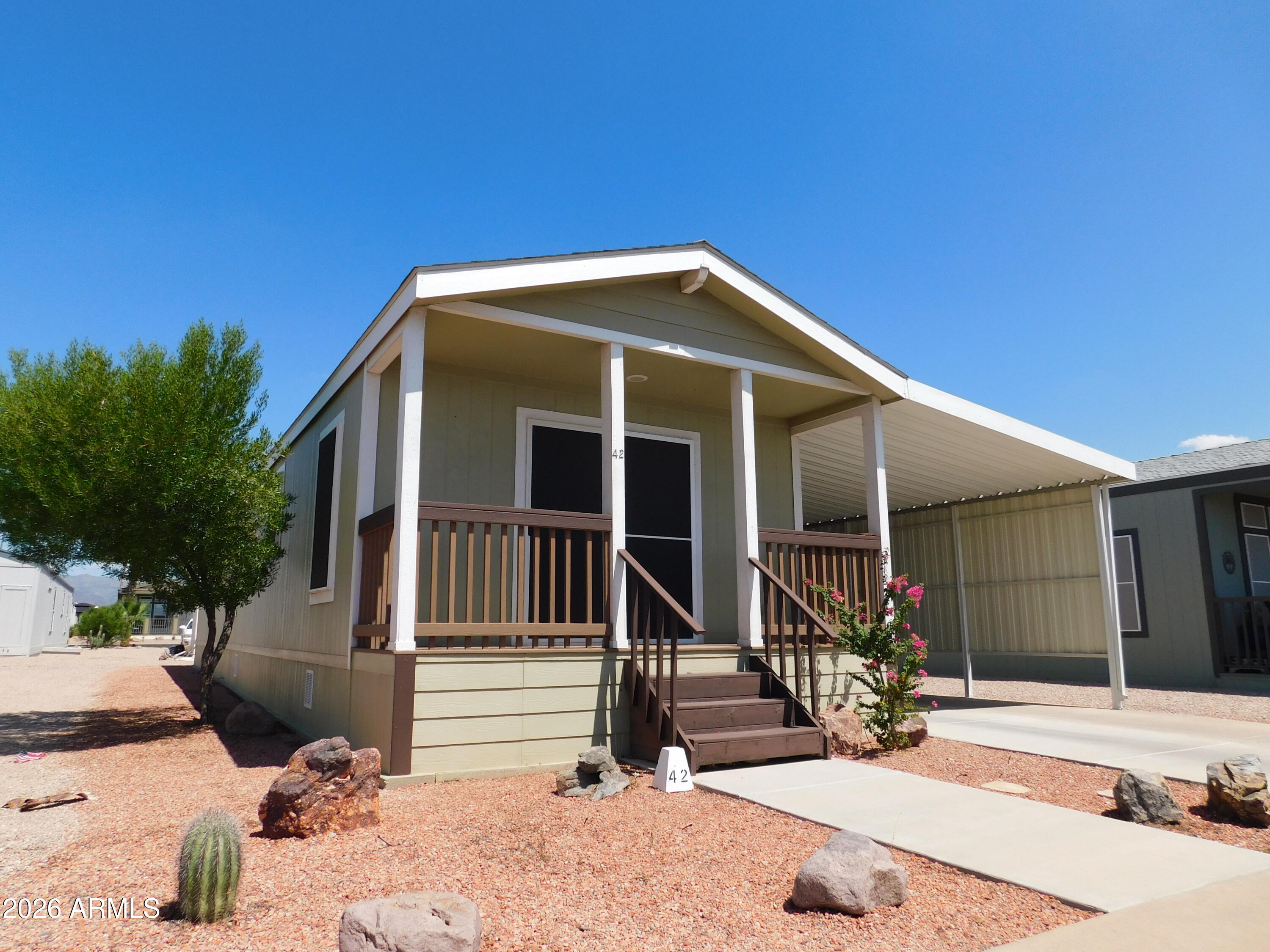 Welcome to this exquisite 2015-built 2-bedroom, 2-bathroom home, where comfort, quality, and thoughtful design come together. Featuring attractive wood siding and beautiful tile flooring throughout, this home has been meticulously updated and is truly move-in ready.
Inside, you'll find wide hallways and doorways that provide easy accessibility throughout the home. The spacious kitchen showcases rich wood-spice cabinetry, while the updated bathrooms feature tasteful western-inspired décor that adds warmth and character.
One of the most valuable recent improvements is the brand-new A/C system installed in 2025, offering peace of mind and energy-efficient comfort for years to come. The location within the community is just as impressive. Situated just a short walk from the pool, spa, mailboxes, and laundry facilities, you'll enjoy the convenience of having the park's top amenities right at your doorstep.

Homes like this don't come along often. Don't miss your opportunity to own this one-of-a-kind home in a desirable retirement community!