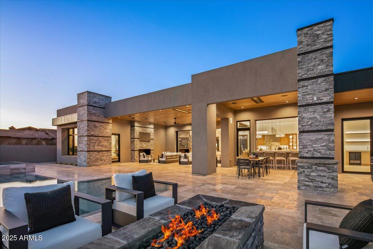 Brand New Custom Contemporary Home just completed on one of the nicest south-facing-fairway lots in the prestigious Mirabel Club community. GOLF MEMBERSHIP AVAILABLE w/ the purchase of this home subject to fees, bylaws and application approval. All of the current state of the art finishes are coming together for this spectacular home. Large set of corner disappearing pocket doors and bar window makes the indoor/outdoor living seamless. Four sided negative edge pool & spa. Located on the 15th fairway boasting views of Pinnacle Peak, the McDowell's, sunsets & amazing city lights. The home has 4 bedrooms, plus media room/5th bedroom & 6.5 baths & an oversized 3 car garage large enough for 3 cars & a golf cart. No steps anywhere in house or backyard. Listing agents are partners in the project