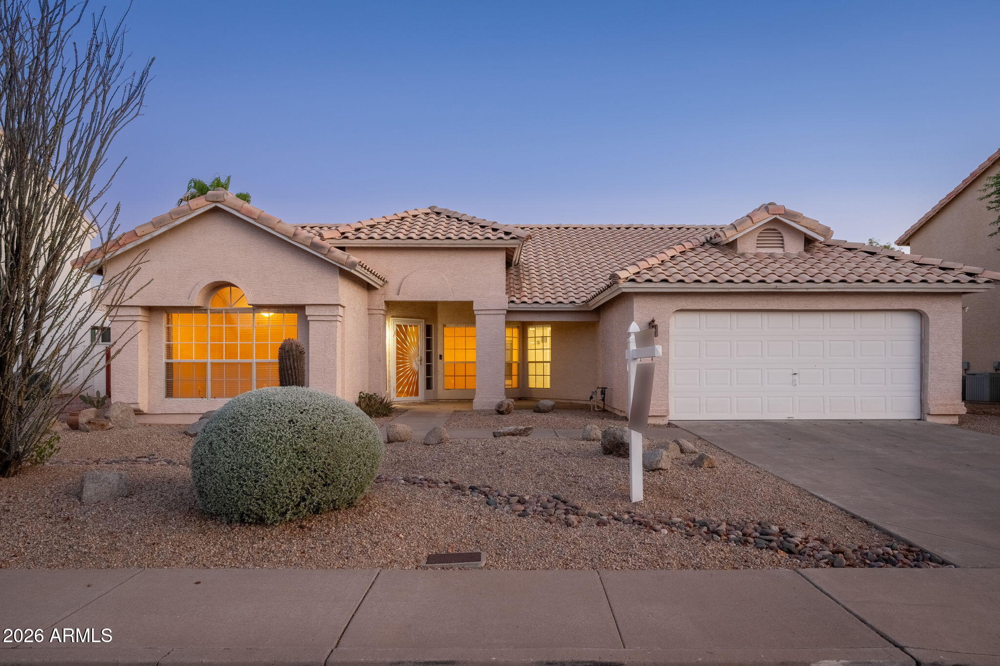 Beautiful North Phoenix home featuring 3 bedrooms plus a dedicated office space with NO HOA! At the heart of the home, the open kitchen is bathed in natural light from an expansive bay window, creating an inviting gathering space. Tile and wood flooring can be found throughout the home, complemented by a highly desirable split floor plan that offers maximum privacy. The spacious primary suite is thoughtfully situated on its own wing complete with a generous walk-in closet. Discover a serene and fully private backyard retreat featuring a covered patio and low-maintenance landscaping with fruit trees. Located close to the popular Desert Ride, CIty North, Costco, shopping, dining, the 101 and 51 Freeways, this offers the perfect blend of beauty, comfort, and convenience. Welcome Home!