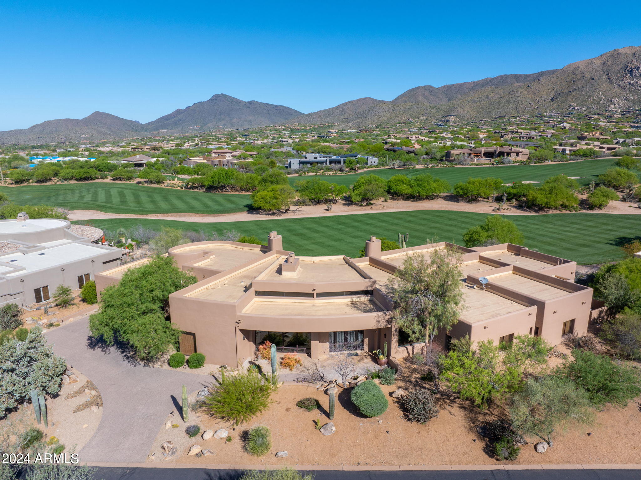 A Golf Membership is available. Experience the epitome of luxury living in this exquisite Desert Mountain home offering views of the 13th and 14th fairways on the Apache Course and a backdrop of the Continental Mountains, Apache Peak and year-round sunsets. The Great Room is an entertainer's dream with a spectacular wet bar to complement the open space. The well appointed and thoughtfully designed kitchen offers upgraded appliances and plenty of storage. A private and inviting owner's suite includes a spa like ensuite and a massive walk-in closet. All bedrooms are ensuite with walk-in closets. An abundance of natural light fills the home by day and cool evenings draw you to the outdoor living spaces with an expansive patio to enjoy spectacular views, a stunning negative edge pool and spa.