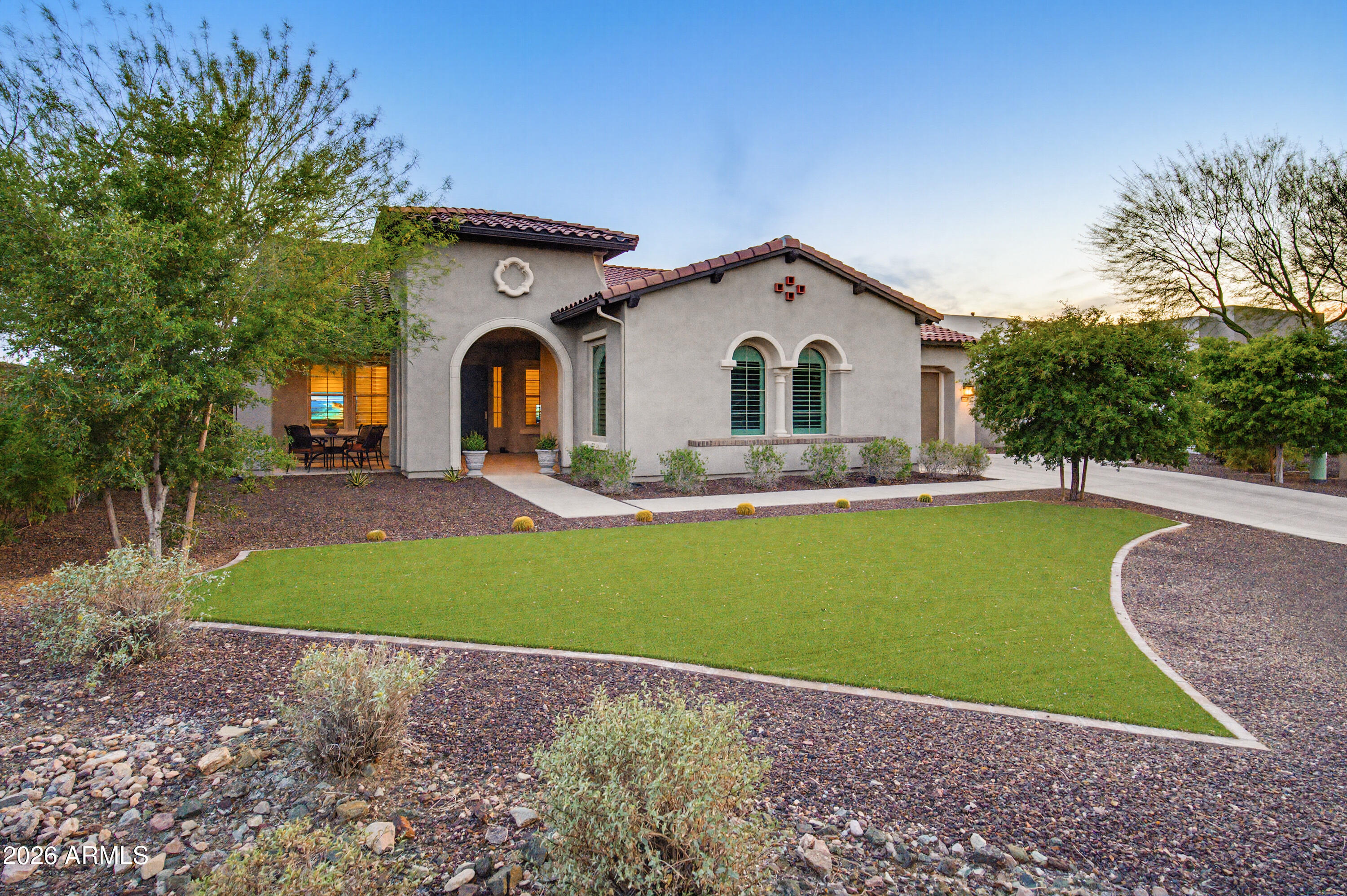 This stunning, heavily upgraded Toll Brothers Blackstone Collection home is located in a guard gated community and minutes to Blackstone Country Club. The Spanish contemporary style, one-level home is in immaculate condition and is at the end of a private cul-de-sac. Featuring 3 bedrooms with a flex 4th bedroom option. The gourmet kitchen includes floor-to-ceiling cabinetry, high-end Kitchen Aid appliances and a large island counter. The private master bedroom suite is luxurious and spacious, complete with a spa-inspired oversized shower and dual walk-in closets. The great room includes a gas fireplace and a 15ft pocket slider door that opens up to a gorgeous resort style pool surrounded by lush landscaping and a brick pizza oven. The spacious lot offers possibilities for adding a casita. Full upgrades include: Resort style pool, water softener/filtration system (Kinetico), wood shutters, fireplace stone, artificial turf (front and backyard), outdoor built-in BBQ and brick pizza oven, Tesla solar, Tesla charging station, irrigation, and much more.