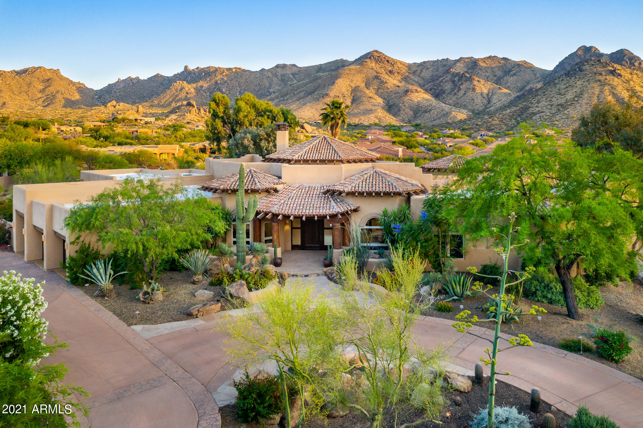 This rare single level N. Scottsdale retreat features a sprawling estate with phenomenal views of the McDowell mountain and Toms Thumb peak not to mention the insane sunsets and beautiful city lights to the west.  This is certainly one of the top 10 viewing homesites in all of Scottsdale.     This move-in ready custom home offers 5,725 square feet of luxury with an ideal layout and split floorplan: 2 bedrooms and billiards room are located in the east wing, with the owners retreat in the west.  Each guest suite has an ensuite bath and a large walk-in closet.   Upon arrival, the property offers a long private drive that leads to a beautiful 3.87 acre estate.   Inside features soaring ceilings, 12' windows in the great room, new Italian marble flooring, a new wet bar w/86 Bottle Sub-Zero wine storage, refrigeration drawers and an ice maker, amazing home theatre and a chef's kitchen along with new energy efficient LED lighting throughout and automated solar shades.  Take advantage of nearly 3,000sf of covered patios and enjoy the backyard resort with plenty of space for relaxing or entertaining: heated pool, spa, sport court and mature landscaping.   Overall, this is a true custom estate that has been meticulously updated by the current owners.   The recent remodel also enjoys new teakwood flooring, new flat roof, new interior paint, new tankless water heater, new wall switches and dimmers, new pool equipment and much more.
 
Resting at an altitude of 2,680 feet, the breathtaking views must be seen and experienced to truly appreciate.