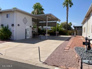 THIS RV LOT  IS THE JEWEL OF THE RESORT.  PRIVACY CREATED ON AN INTERIOR WALL.  A DESIGNER KITCHEN HAS BEAUTIFUL STAINLESS CABINETS, GREAT BUILT-IN BBQ AND COOKTOP, CLASSY TILE COUNTERS WITH BAR SEATING, SINK, DISPOSAL AND DISHWASHER. ENJOY THE TILED OUTDOOR PATIO AREA FOR ALL TO ENJOY WITH TWO FANS TO KEEP YOU COOL. PATIO AREA ALSO HAS AWNING DROP DOWN SCREENS FOR LOTS OF PRIVACY.  A TWO STORY SHED HAS STACKABLE W/D, REFRIGERATOR/FREEZER/ , LOTS OF CABINET SPACE AND AN ENCLOSED TOILET.  ROOM FOR ALL YOUR EXTRAS IN THE SECOND FLOOR.  AND DID I MENTION THERE IS A HOT TUB!!!!!! THIS PLACE HAS IT ALL.