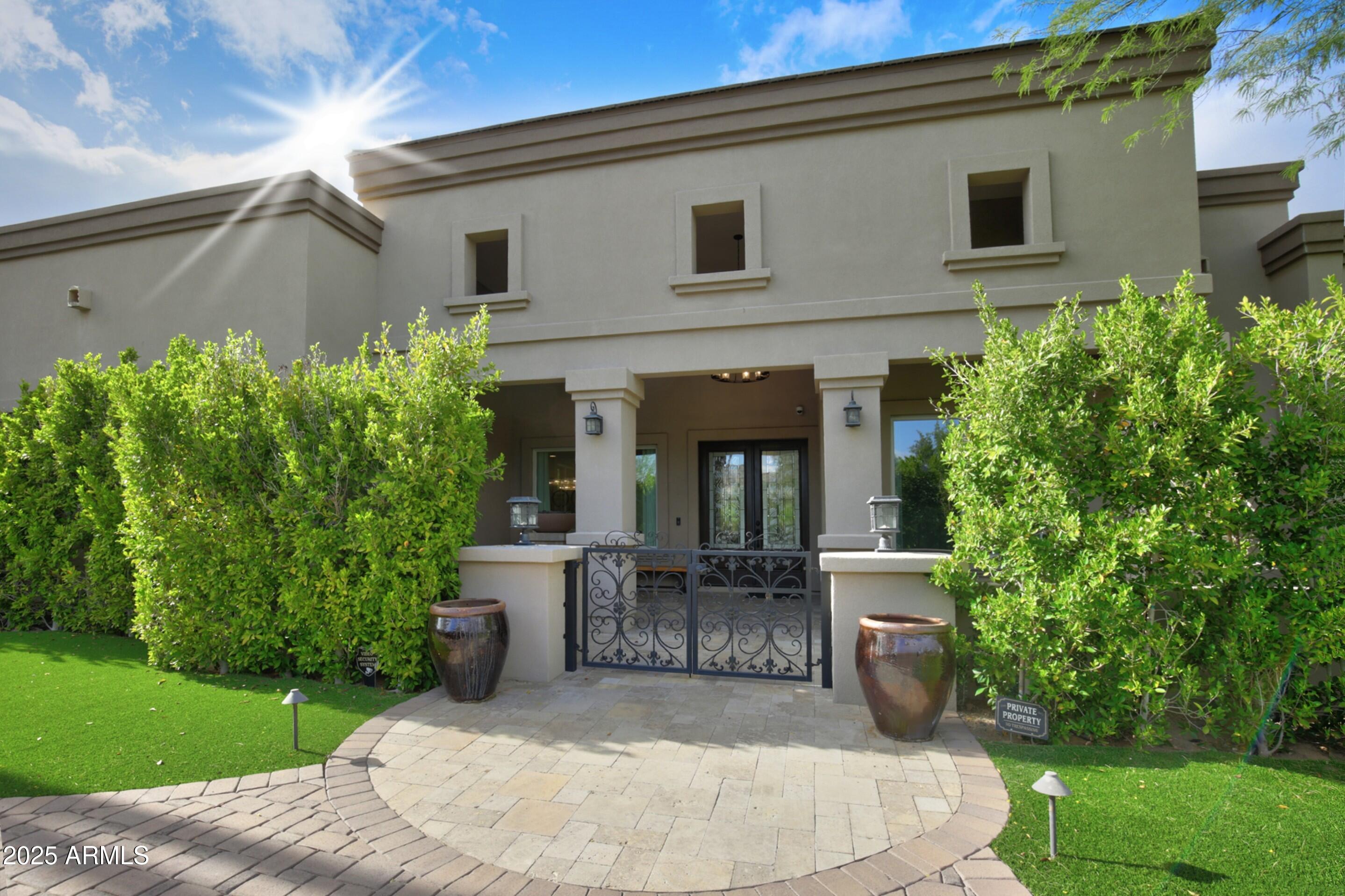 Custom Desert Modern built in 2016 offers effortless spaces for relaxed yet refined entertaining. An inviting outdoor dining terrace with fireplace and expansive covered patios line the pool, giving main living areas seamless views. The chef's kitchen connects to the breakfast room, butler's pantry, bar, terrace, and family room with soaring fireplace. The open floor plan highlights clean lines, wood floors, and light-filled interiors. A spacious second office doubles as a game or media room. Entertainment continues in the poolside guest house with full kitchen, bedroom, and living room with fireplace. All bedrooms feature en-suite baths and walk-in closets. Backyard showcases custom turf designed for golf practice and play.  A new roof.  A must see!
