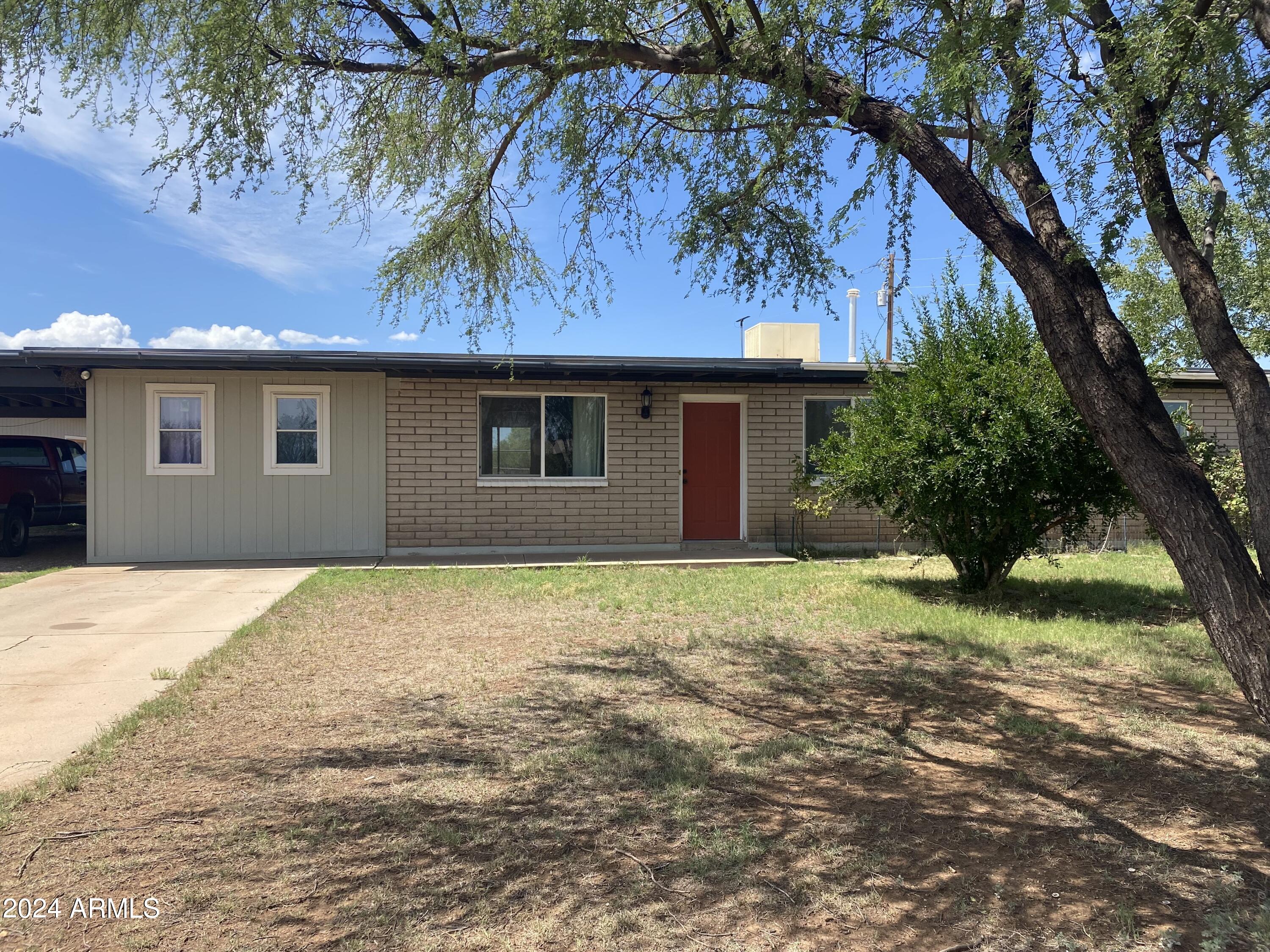 This serene property is a piece of desert paradise and ready for you to call it HOME. 
Over half an acre, fully fenced yard with beautiful mountain views and plenty of space to enjoy the Arizona sunsets, cookouts, or just enjoy the peaceful surroundings. A 4 bedroom home with a very large laundry room, spacious kitchen, dining room and a very large pantry. 
This property also boasts a 1200 sq foot garage with 10 foot ceilings, RV hook up and a privately owned well. Do not miss the opportunity to call this place YOURS!