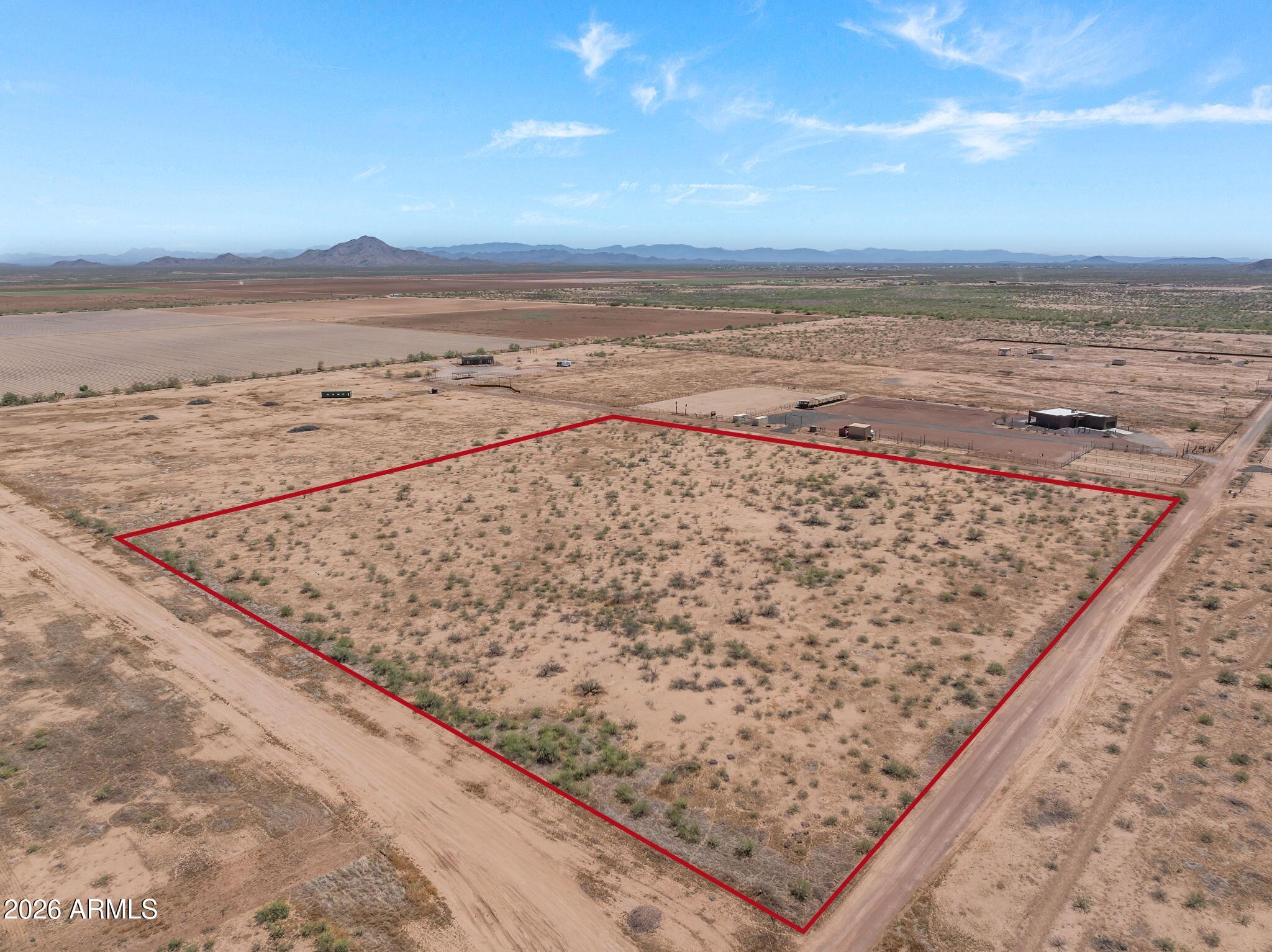 Beautiful 10-acre corner parcel located in Aguila with stunning mountain views and excellent, usable ground. This property is serviced by a shared well and is subject to CC&Rs that help protect property values while allowing for quality stick-built homes. The parcel offers the flexibility to be split into two separate 5-acre parcels, creating excellent investment or future development potential.Enjoy the peaceful rural lifestyle with State Land nearby, providing easy access to riding, hiking, and outdoor recreation. Conveniently located just 25 minutes from Wickenburg and only 5 minutes from local amenities including a gas station, feed store, dollar store, and restaurant. NO HOA Whether you're looking to build your dream home, horse property, or invest in Arizona land, this parcel offers a great combination of location, views, and opportunity.