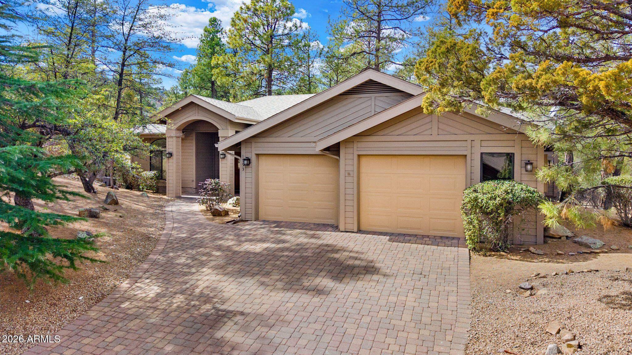 First time on the market! This spacious and thoughtfully designed 4-bedroom home in the highly desirable Timber Ridge community is truly a rare find. Set at the end of a quiet cul-de-sac, the property sits on one of the largest parcels in Timber Ridge--an exceptional .97-acre lot that was originally three and a half separate lots, now combined into one expansive homesite.
Surrounded by towering pines, the setting feels like your own private park, complete with a seasonal creek and two generous decks that offer peaceful outdoor living and exceptional privacy. Inside, the open-concept main level is both functional and inviting, with soaring vaulted ceilings and a seamless flow between the living room, dining area, and kitchen. The living room features a stunning picture window, stone firepl exclusively to one side of the home and includes a sizable walk-in closet and french doors leading to a large deck. 2 additional bedrooms and a full bathroom grace the opposite side of the main level, creating ideal separation for family or guests. Downstairs, a versatile lower-level retreat with its own bath and patio access can function as a guest suite, media room, office, or multi-generational living space. Plenty of storage and an oversized 2-car garage complete the package. New exterior and interior paint and new flooring throughout, truly make this property move-in ready. Come claim your new life of comfort, privacy and tranquility in the temperate mountains of Prescott - Timber Ridge living at its best!