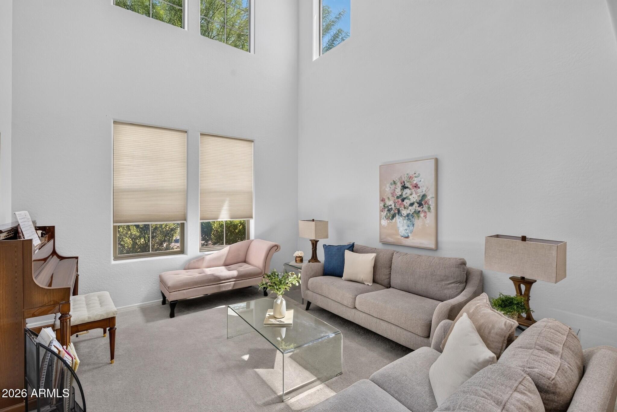 Offering one of the BEST VALUES in the neighborhood this rare 3- CAR GARAGE, with just about 2,800 sq ft of living space, OWNED SOLAR, sitting on an OVERsized lot is a RARE FIND! FRESHLY PAINTED on the exterior and INTERIOR with OWNED solar for added energy savings, this impressive two-story home offers 4 bedrooms, a versatile loft, soaring VAULTED CEILINGS, and nearly 2,800 square feet of thoughtfully designed living space.

Natural light fills the home, creating a bright and welcoming atmosphere from the moment you step inside. The spacious kitchen features QUARTZ countertops, rich cabinetry, a large center island, WALK-IN PANTRY, and abundant counter space, making it ideal for everything from busy weekday mornings to holiday gatherings. The loft provides an additional living space perfect for a playroom, or home office while the generously sized secondary bedrooms ensure everyone has room to spread out and feel at home. Additional features including under-stair storage, a large laundry room, and multiple living areas add even more functionality to the home.

The OVERSIZED PRIMARY suite serves as a private retreat, complete with DUAL VANITIES, a WALK-IN CLOSET, and a SEPARATE TUB AND SHOWER.

Step outside to an entertainer's dream backyard. Situated on an oversized lot, the outdoor space features a COVERED PATIO, PERGOLA, BUILT-IN BBQ, flagstone pavers, artificial TURF, mature desert landscaping, and a relaxing 6 person JACUZZI. Whether you're hosting weekend gatherings, enjoying family time outdoors, or unwinding under the Arizona sky, this backyard is ready for it all. A 3-CAR GARAGE and RV GATE provide additional storage and parking options rarely found at this price point.

Combining owned solar, fresh exterior paint, exceptional indoor and outdoor living spaces, and an incredible amount of square footage for the money, this home delivers the perfect blend of affordability, comfort, and room to grow.
