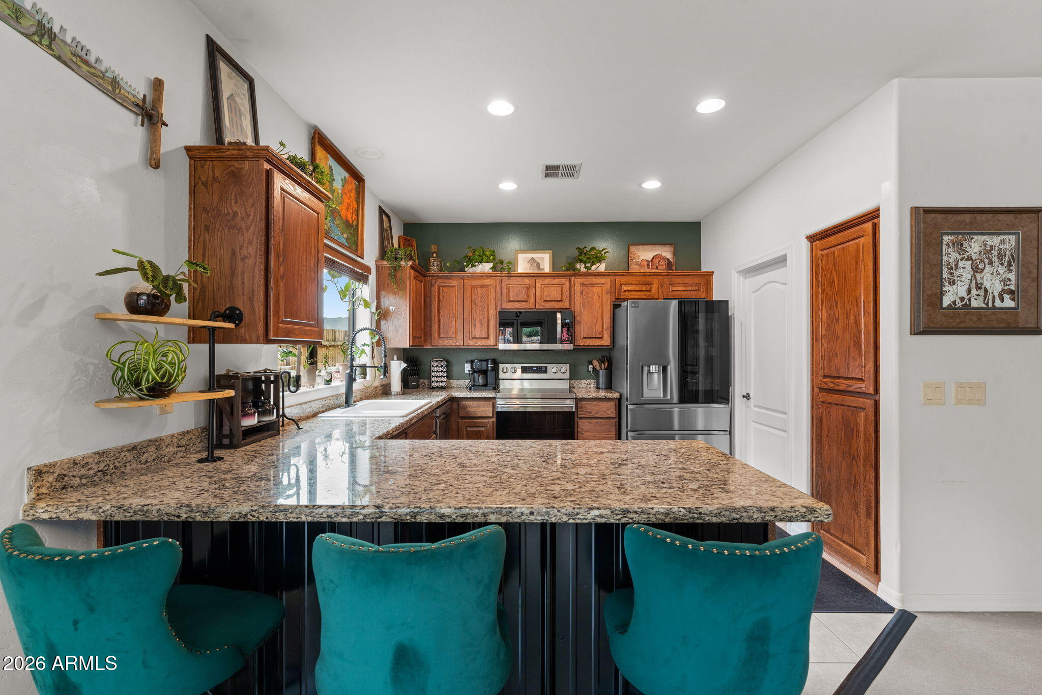 Welcome to this beautifully maintained 3-bed, 2-bath home with a 2-car garage on a quiet street in Congress! Enjoy AMAZING views of the Weaver and Bradshaw mountains from this 1,433 sqft single-level retreat. Features include French doors, wood blinds, ceiling fans, granite counters, a split master with double vanity, polished concrete flooring, fresh interior paint, and carpet installed (April 2026). Modern stainless steel appliances convey--refrigerator, dishwasher, range/oven, microwave, and washer/dryer!  Exterior paint in 2022 and an OWNED solar system mean energy savings from day one. Enjoy a large shed/shop with power and relax on the covered patio. Move-in ready and priced for a QUICK SALE.