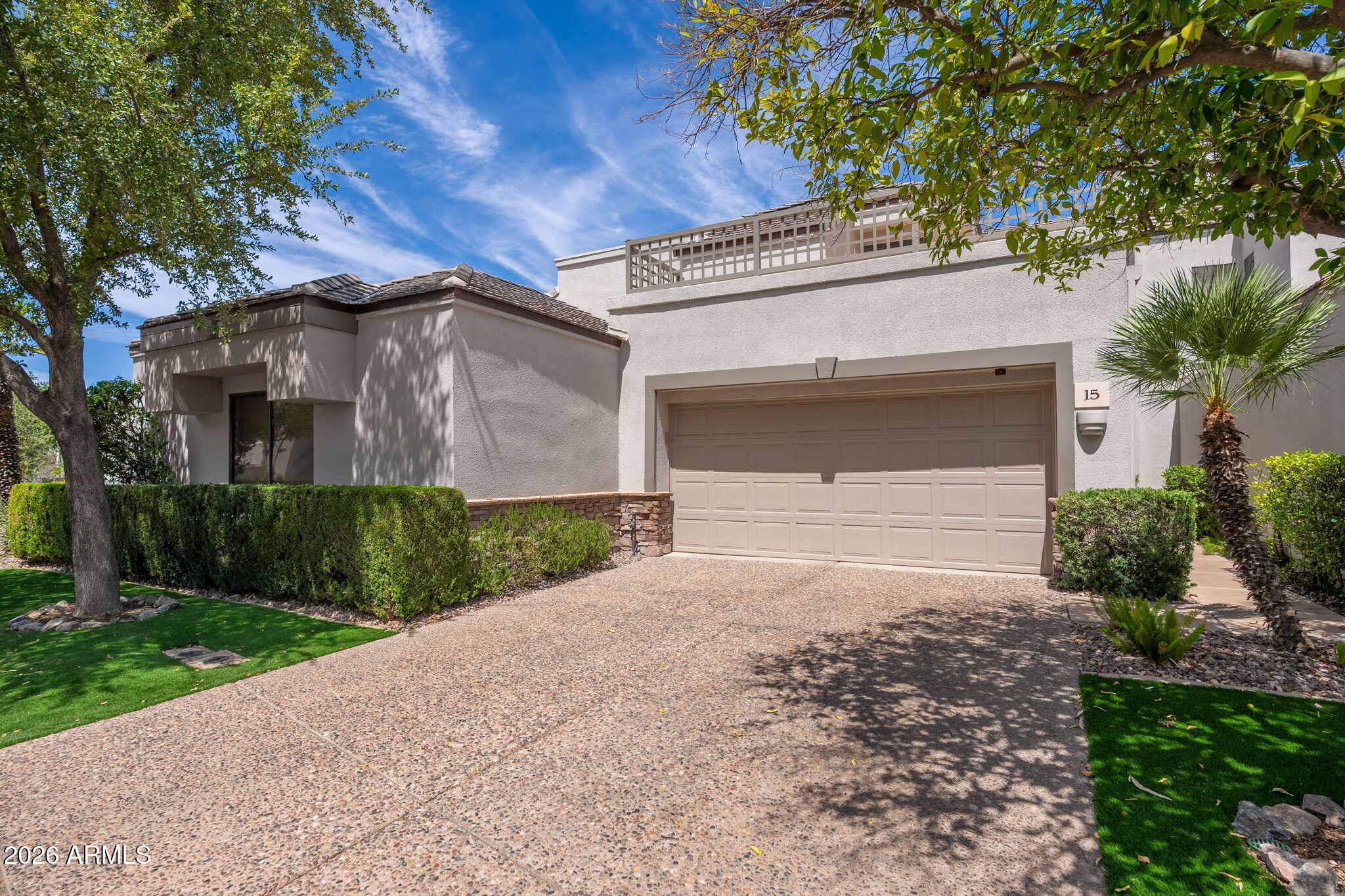 Experience resort-style living in this beautifully updated townhome, perfectly positioned in one of Gainey Ranch's most desirable locations. The open-concept floor plan is filled with natural light, thanks to expansive windows that frame the stunning golf course, lake, and mountain views throughout the home. Step outside to your private patio and enjoy sweeping fairway vistas, creating the perfect setting for relaxing or entertaining.
The thoughtfully redesigned kitchen features quartz countertops, custom designer cabinetry, premium finishes, and breakfast nook. Gorgeous 24-inch porcelain tile flooring featured throughout the main living areas, creating a sophisticated and seamless feel. Upstairs, you'll find two luxurious primary suites. The primary bedroom offers a spa-inspired bath with custom cabinetry, quartz counters, a freestanding soaking tub, and a walk-in shower, along with a private balcony perfect for enjoying morning sunrises. The second suite features a walk-in closet and updated bath. 
A versatile loft area between the suites provides the perfect space for a home office, den, reading room, or fitness area. Additional highlights include a spacious laundry room and direct access from the attached two-car garage along with a powder bath on the first floor. Ideally situated within the community, residents enjoy a short walk to the pool and spa, the Grand Hyatt Scottsdale Resort, world-class dining, shopping, and walking paths. Gainey Ranch offers an exceptional lifestyle with 24-hour guard-gated security, a private clubhouse, fitness center, tennis and pickleball courts, and an array of exclusive resident amenities.
Move-in ready and impeccably updated, this is a rare opportunity to own a lock-and-leave on the golf course luxury retreat in the heart of Scottsdale.