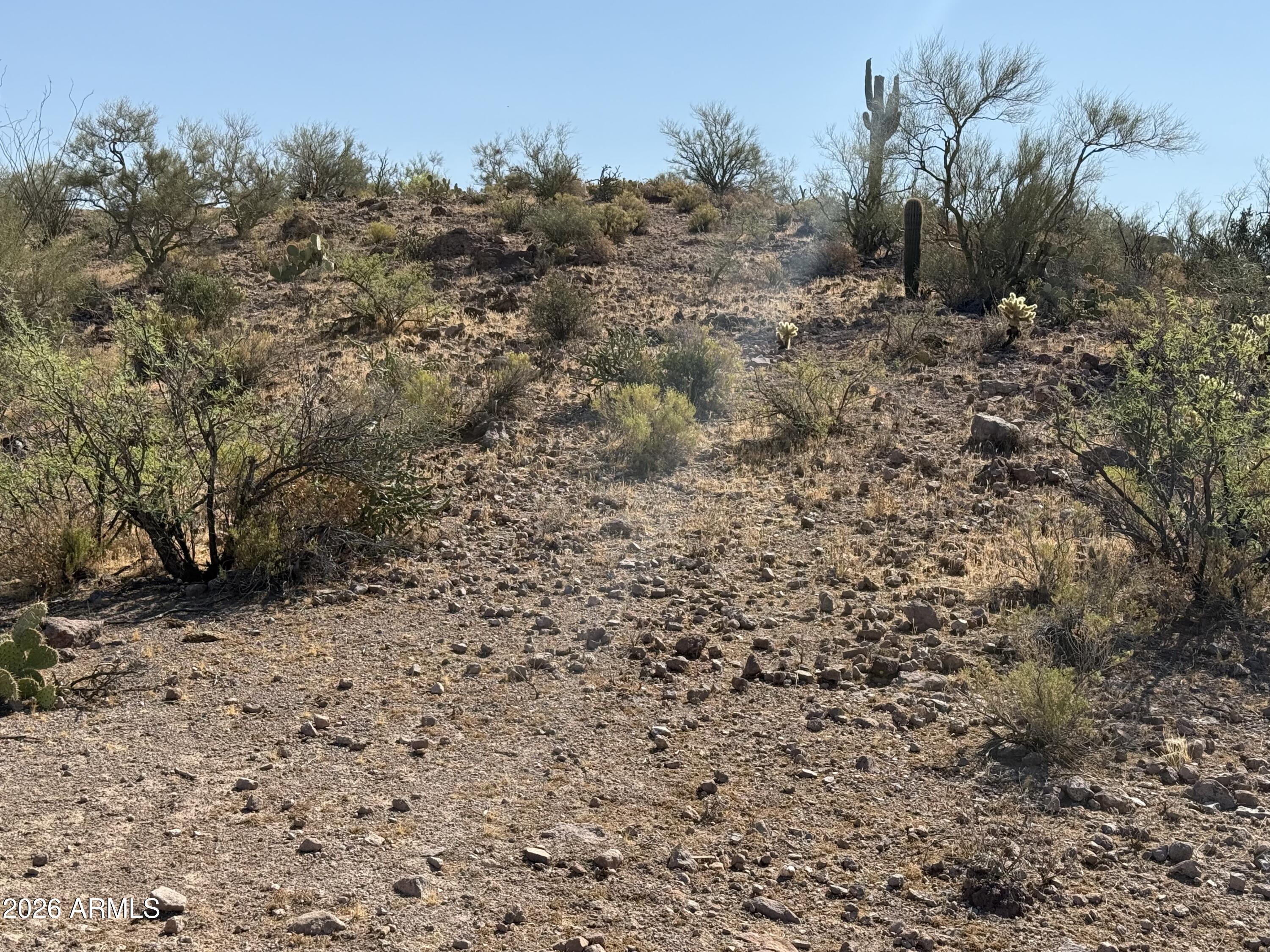 development site on easy rolling landscape.corner lot ,ELECTRIC across the rd, or you can purchase the lower half of Lot 44
approx 12 miles north of the lake gravel/dirt rd in the foothills of the Bradshaw Mountains some of the most