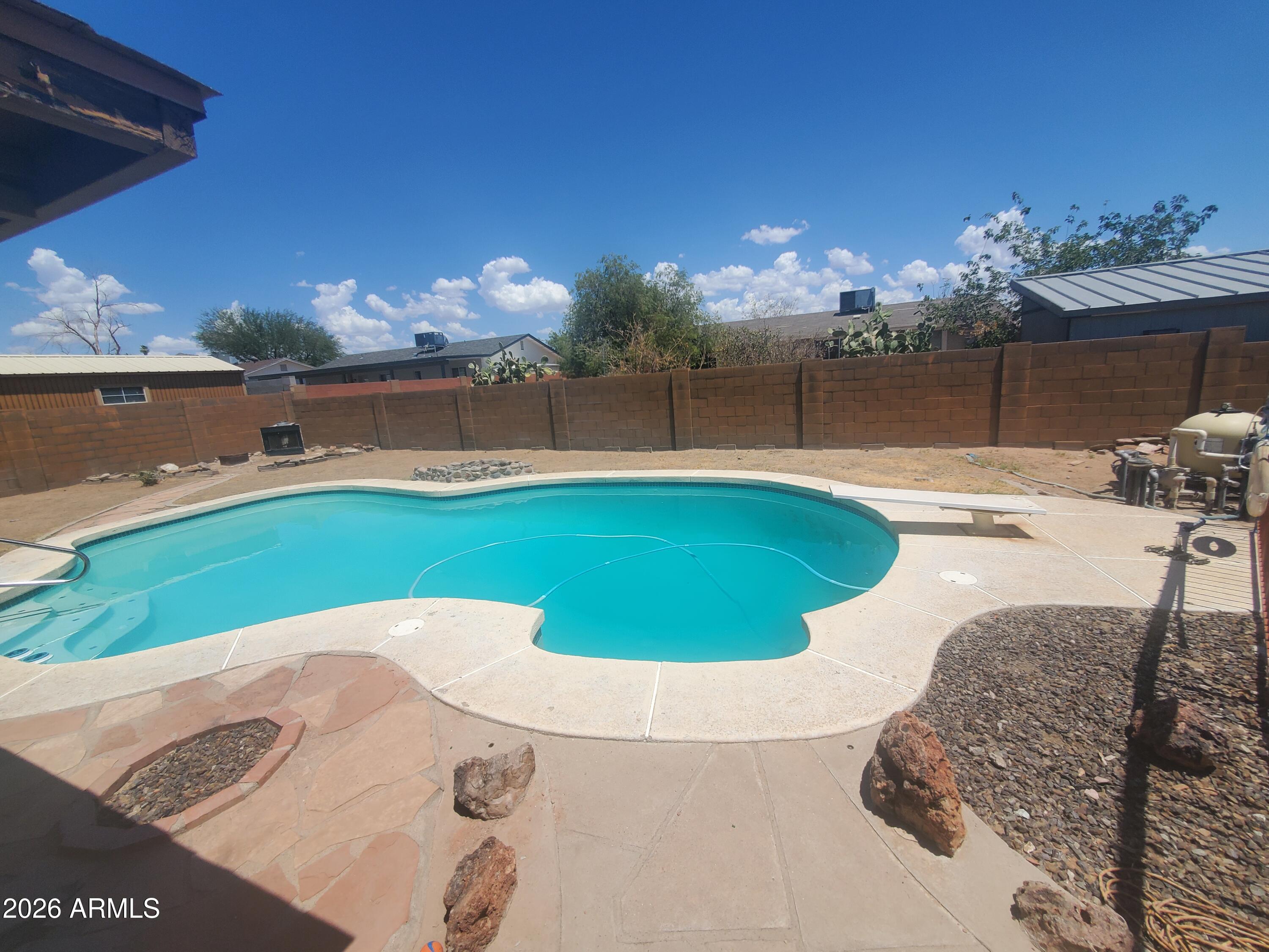 Beautiful 3-bedroom, 2-bath home with a sparkling diving pool and stunning mountain views! This home features a spacious open great room, generously sized bedrooms, and a versatile bonus room off the laundry area that's perfect for a home office, den, or extra storage. Step outside to a huge backyard with a fenced diving pool--ideal for entertaining or relaxing. Conveniently located near freeways, schools, shopping, dining, and more.