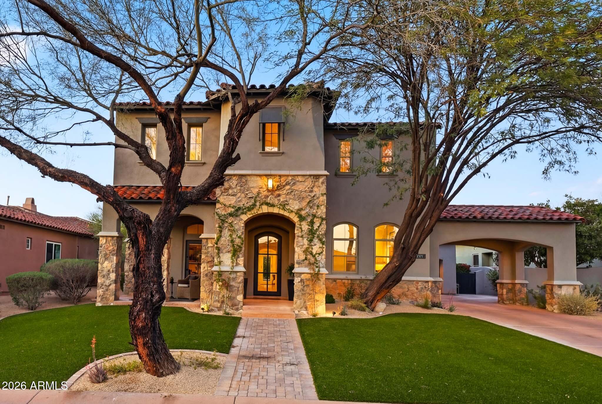Beautifully updated DC Ranch estate offering over 4,200 square feet of thoughtfully curated modern design, backing to a natural desert wash with sweeping McDowell Mountain views. This 4-bedroom, 3.5-bath residence w/ a 3 car garage has been fully reimagined with modern and designer finishes. This residence is truly move in-ready. Experience elevated desert living in one of North Scottsdale's most sought-after communities.
The home features include wide-plank oak flooring, soaring ceilings, contemporary lighting that enhance the bright and open floorplan. Recent updates include: tinted windows, built-in sound system, electronic window shades, and a new HVAC system (2023).
The chef's kitchen showcases Wolf and Sub-Zero appliances, custom cabinetry, an oversized waterfall island with premium stone, Calacatta marble backsplash, and designer pendant lighting. The open-concept kitchen opens to the great room that features a striking fluted wood accent wall, contemporary wine display, and gas fireplace ideal for entertaining.
Upstairs, the split floorplan features three spacious guest bedrooms and a dedicated media room. The primary suite offers a private sitting area with sprawling McDowell Mountain views. The spa-inspired bath includes a freestanding soaking tub, oversized walk-in shower, modern light fixtures, and custom built-ins in the primary closet.
The home's outdoor spaces include a private front courtyard with custom metal gate, bistro lighting, and stone fireplace. The backyard is designed for entertaining and resort living with a pool, synthetic turf, modern desert landscaping, and a custom outdoor kitchen.
Ideally located in the heart of DC Ranch, this property is within a gated community that's steps from the newly renovated Desert Camp Community Center with a resort-style pool, tennis and pickleball courts, and the new fitness facility. Enjoy over 28 miles of private walking and biking trails, nearby parks, and easy access to Market Street's shopping and fine dining. Experience the best of upscale living in one of DC Ranch's most sought-after communities.