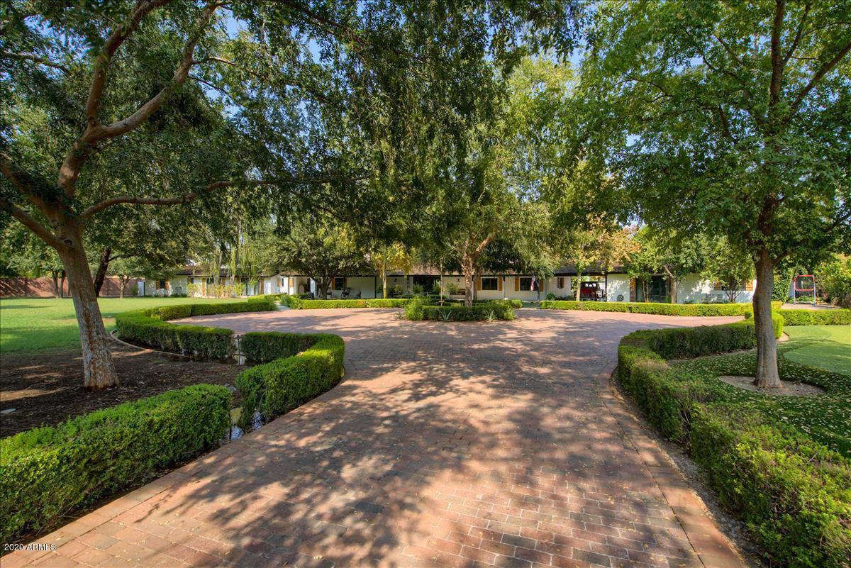 ONE OF A KIND. GATED NORTH CENTRAL ESTATE SITUATED ON THE HISTORIC MURPHY BRIDAL ON A 1.69 ACRE LOT. BEAUTIFULLY APPOINTED T/O. EXPANSIVE FAMILY ROOM WITH FIREPLACE, FORMAL LIVING AND DINING ROOMS, AND A SITTING ROOM OFF THE ENTRY. GOURMET KITCHEN HAS MARBLE COUNTERS, OVERSIZED ISLAND, TOP OF THE LINE APPLIANCES INCLUDING SUB ZERO & 6 BURNER VIKING STOVE & LG EAT IN AREA. OWNERS SUITE IS TRULY AMAZING WITH SITTING AREA, LUXURY BATH, FIREPLACE & EXTERIOR LAP POOL JUST STEPS OUTSIDE THE BEDROOM DOOR. THE PARK-LIKE GROUNDS ARE INCREDIBLE WITH PLENTY OF GRASSY AREAS, 3 PATIOS, 2  POOLS, RAMADA, PUTTING GREEN & 3 CAR GARAGE. THERE ARE 4 AC'S IN THE MAIN HOUSE & 3 ARE NEWER. AC IS NEW IN  GUEST HOUSEMAIN HOUSE HAS 6923 SQ FT WITH 5 BDR'S/5.5 BATHS. 803 SQ FT GUEST HOUSE & 322 SQ FT EXERCISE ST