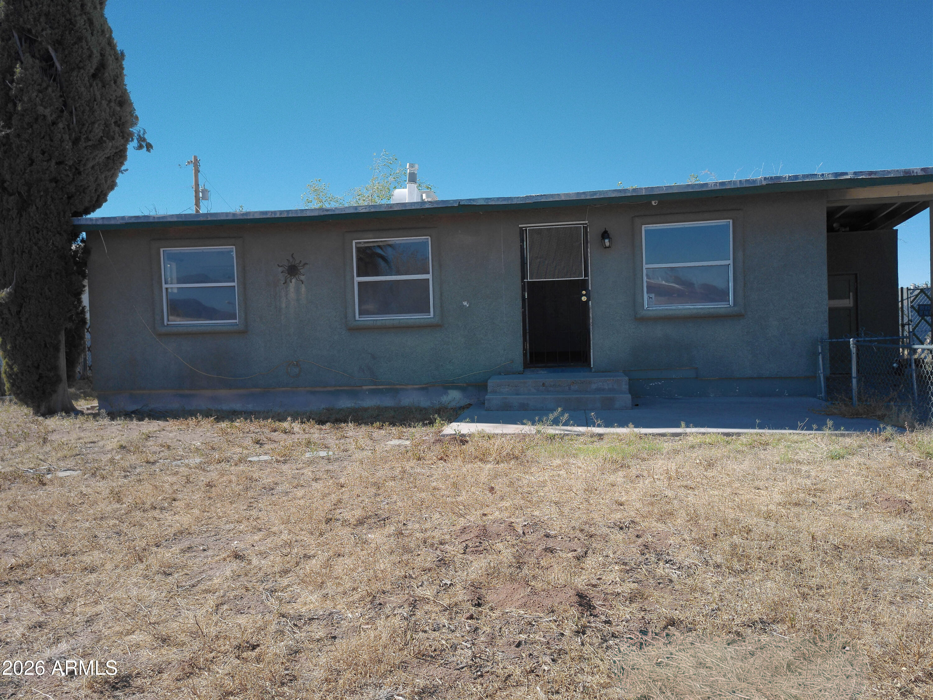 Opportunity awaits with this 3 bedroom, 1 bath corner lot home featuring spacious, fenced front and back yards, covered carport parking, and additional storage in the laundry room. This site-built property is full of potential and ready for renovation or customization. Sold as-is.