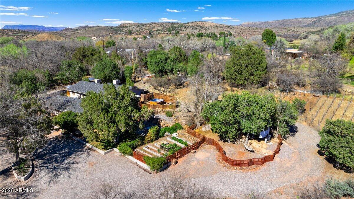 One-of-a-Kind Luxury Estate in the Heart of Cornville, Arizona
Welcome to an extraordinary and truly rare offering--this fully custom, luxuriously remodeled estate is set on 1.62 private acres and designed for those who seek beauty, craftsmanship, and a lifestyle beyond the ordinary.

Spanning over 3,922 sq ft, this stunning residence features 5 bedrooms and 6 bathrooms, each space thoughtfully curated with refined finishes and timeless elegance. From the moment you enter, you're greeted by a dramatic custom Brazilian Hickory wood staircase, exquisite stonework, and fireplaces in every room, creating warmth and ambiance throughout. The heart of the home showcases a chef-inspired kitchen with custom concrete countertops, complemented by equally distinctive finishes in the bathrooms--blending artistry with modern luxury.
Step outside into your own private resort. Entertain effortlessly with a spectacular covered Palapa outdoor kitchen with metal roof, surrounded by beautiful stone accents and inviting gathering spaces. Relax and unwind in the spa, or enjoy the active lifestyle with your very own private pickleball court.

For the wine enthusiast, the property offers a personal vineyard with 200 vines and a charming wine cellar, creating a true vineyard estate experience.

Additional highlights include:
" Two HVAC systems (Goodman & Carrier)
" Three new Goodman mini-split AC units
" Additional buildings ideal for office, gym, or guest spaces
" Irrigation system and lush usable land
" Enhanced exterior with custom stone accents for a refined lodge-style presence

This exceptional property offers endless possibilities--perfect for luxury living, multi-generational living, entertaining, or a high-end Airbnb/short-term rental investment.

A rare blend of elegance, lifestyle, and opportunity--this is more than a home, it's a legacy property. Must see to truly appreciate.

Prime Irrigated Property on the Mason Irrigation Ditch , Only $200 a year.