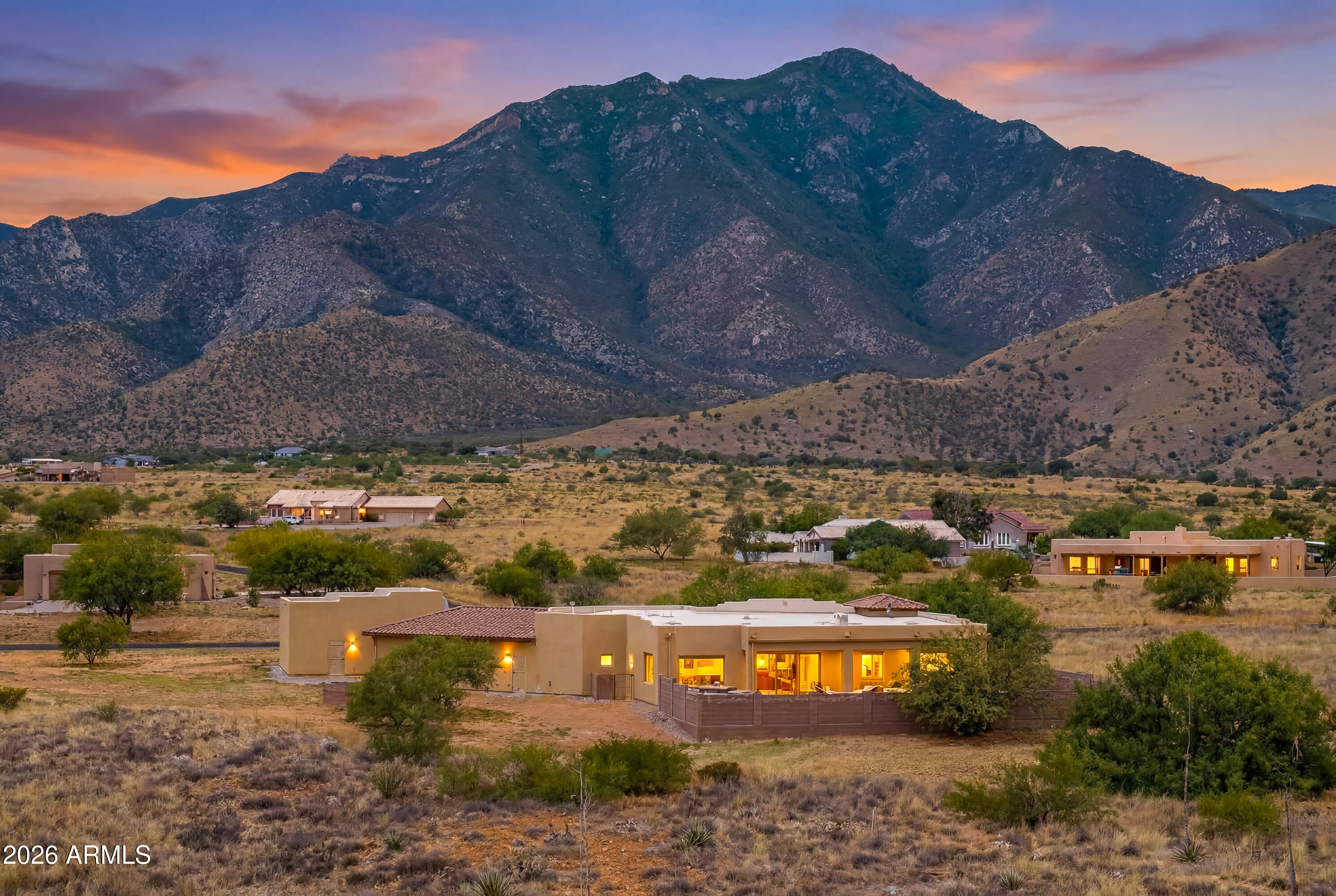 Enjoy stunning mountain views from this custom-built home featuring 3 bedrooms, a den/office, and 2 bathrooms. The thoughtfully designed interior offers polished concrete floors, tray ceilings with recessed lighting, lighted niches, newer kitchen appliances, and a tankless water heater. Relax in the front courtyard or entertain on the private back patio with a custom outdoor fireplace and built-in seating. A rare highlight is the 30x30 detached garage/shop, providing ample space for vehicles, hobbies, or storage. Both the attached garage and detached shop feature commercial-grade polyaspartic floor coatings. HOA dues include high-speed internet and access to a private water company.
