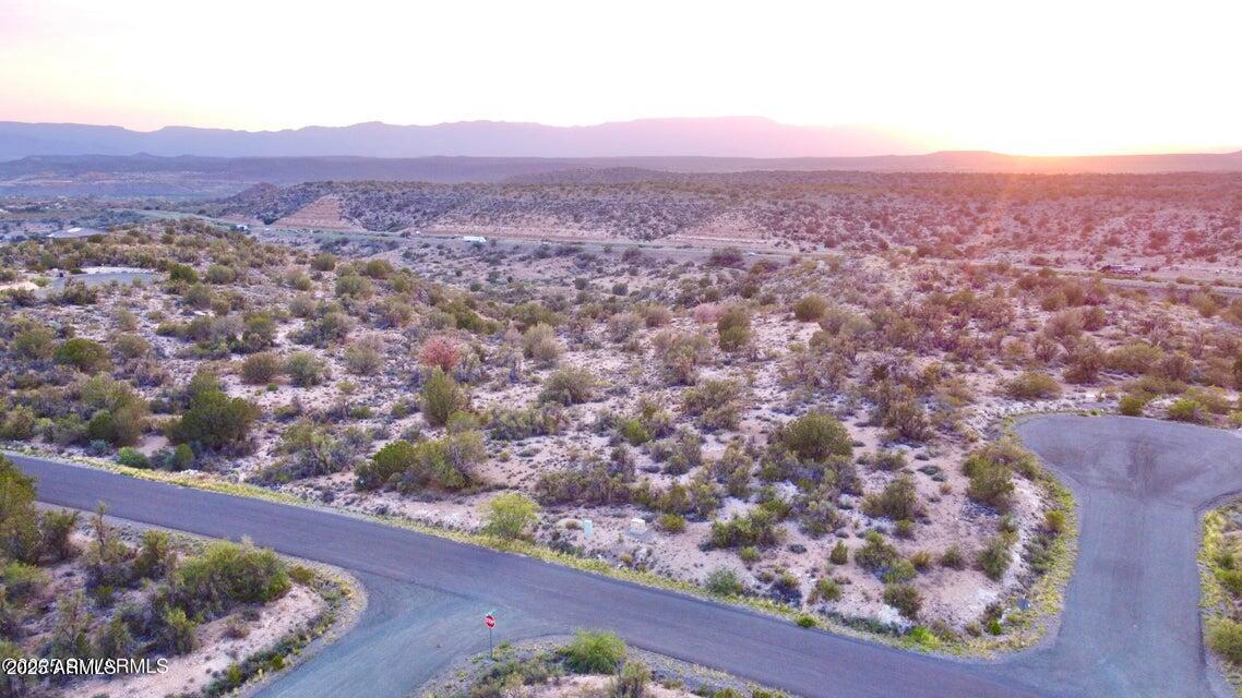 Come see this enchanting corner lot in Thunder Ridge. Views stretch for miles all the way to the Sedona Red Rocks, and you are situated perfectly to take in those renowned AZ sunsets. Thunder Ridge HOA boasts a beautiful clubhouse & pool, and gorgeous homes seamlessly tucked into the high-desert landscape. Purposefully designed with plenty of buffer between homes. Would need a well and septic, minimum build 1800 sq ft. Transformer box near the road. Owner Might Carry with 20% Down! Come see...