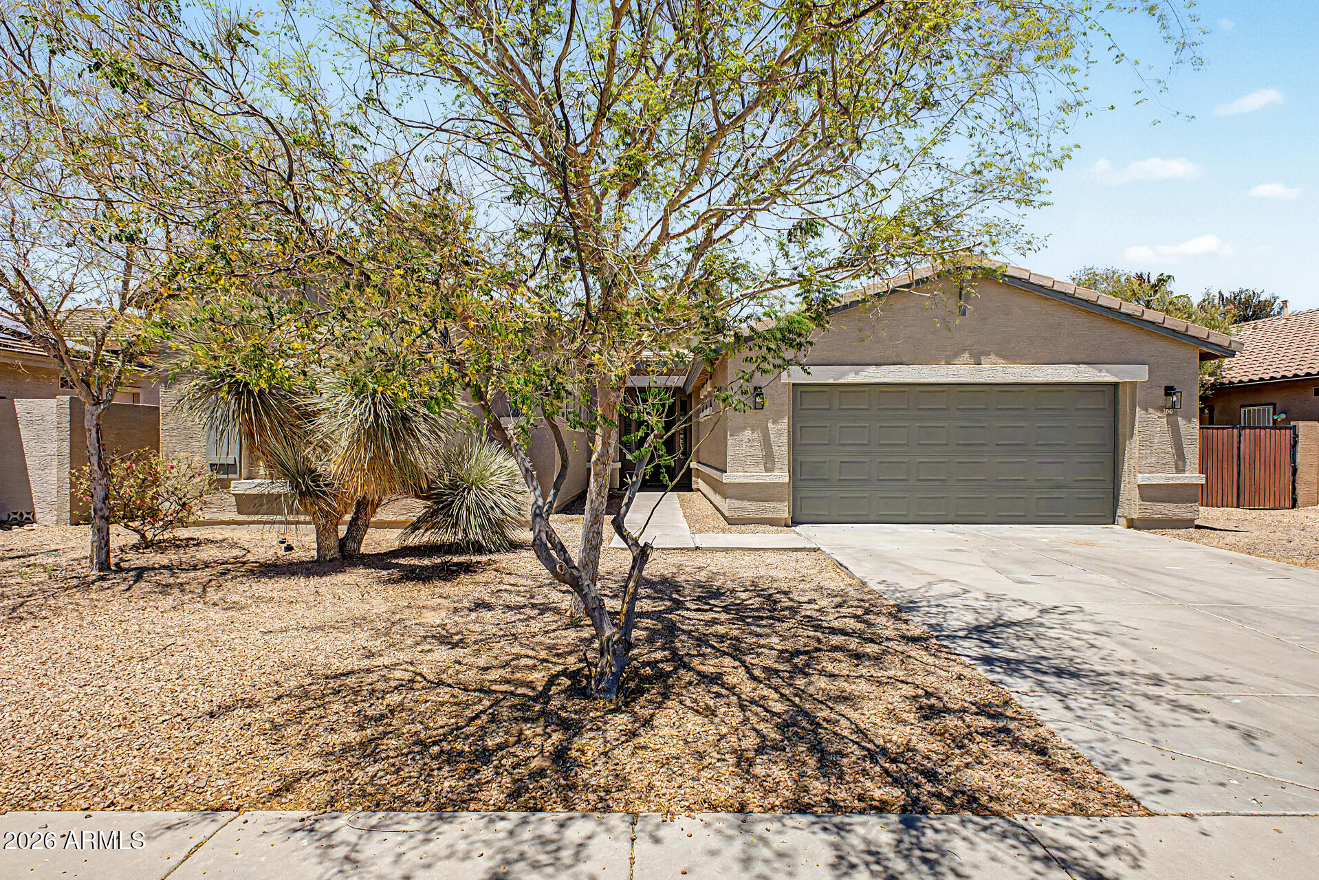 Welcome to this beautifully updated single-level home in the highly desirable Villago community. Featuring 4 bedrooms, a split floor plan, soaring ceilings, and an expansive open-concept living area, this home offers the perfect combination of comfort, functionality, and style. Recent upgrades include brand-new luxury vinyl plank flooring throughout, new modern baseboards, fresh interior paint, and fresh exterior paint, creating a truly move-in ready experience. The spacious great room floor plan is ideal for both everyday living and entertaining, with abundant natural light and seamless flow between the living, dining, and kitchen spaces. The chef-inspired kitchen features granite countertops, custom tall cabinetry, a pantry, stainless steel GE appliances, a gas range, and an upgraded GE Profile French door refrigerator. The home is also pre-plumbed for reverse osmosis and a water softener system for added convenience. The private primary suite is thoughtfully separated from the secondary bedrooms and serves as a peaceful retreat. It features dual vanities, a large garden tub positioned beneath an oversized window, a separate glass-enclosed shower, and a spacious walk-in closet. Secondary bedrooms include ceiling fans, plantation shutters, and easy access to built-in hallway storage cabinets. Additional upgrades include plantation shutters throughout, upgraded lighting and ceiling fans, custom cabinetry in the kitchen, bathrooms, hallway, and laundry room, as well as a solar system that helps reduce utility costs. Step outside to enjoy the low-maintenance backyard featuring a full-length covered patio and custom pergola, creating the perfect space for outdoor dining, entertaining, or simply relaxing and enjoying Arizona's beautiful weather. Combining energy efficiency, thoughtful upgrades, modern finishes, and a highly desirable floor plan, this home is move-in ready and offers an exceptional opportunity to enjoy the best of Arizona living.