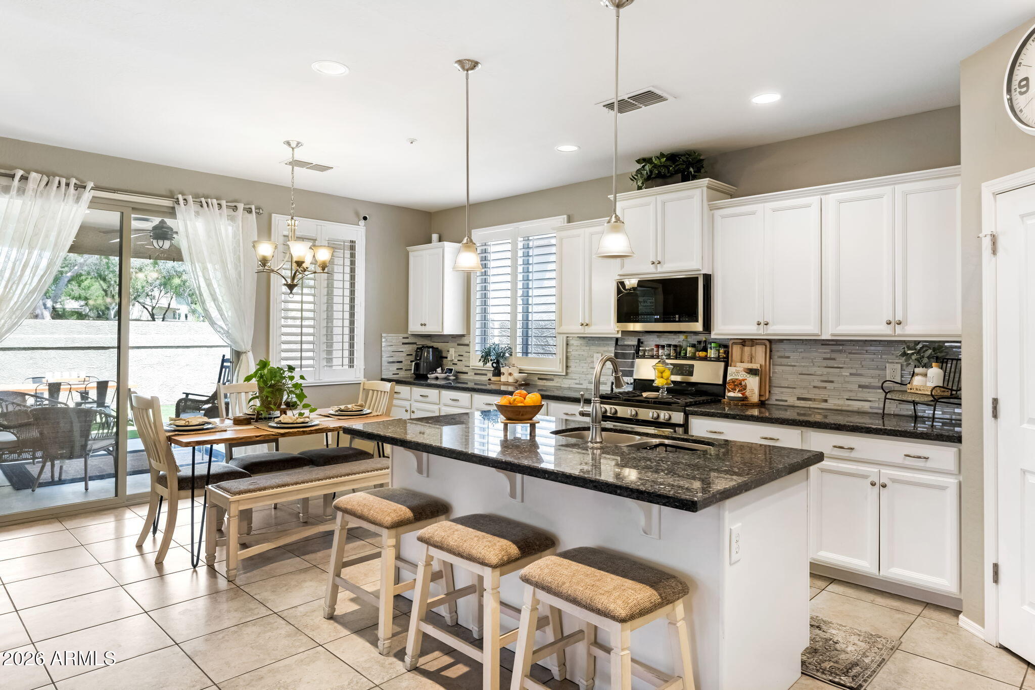 If location matters this one delivers. Set in a cozy neighborhood just minutes from the 101 Freeway, medical facilities, Arrowhead Towne Center, and the energy of P83 dining, this home checks all the boxes. Plus, you're close to the New River Trail for miles of walking and biking.
Inside, the split layout offers smart design with guest bedrooms up front and a private primary retreat in the back. The primary bath includes a generously sized shower and dual sinks. The open kitchen with a large granite island connects the living space, ideal for entertaining or everyday living. Low maintenance outdoor space  keeps upkeep simple and stress-free. Welcome to Peoria, AZ