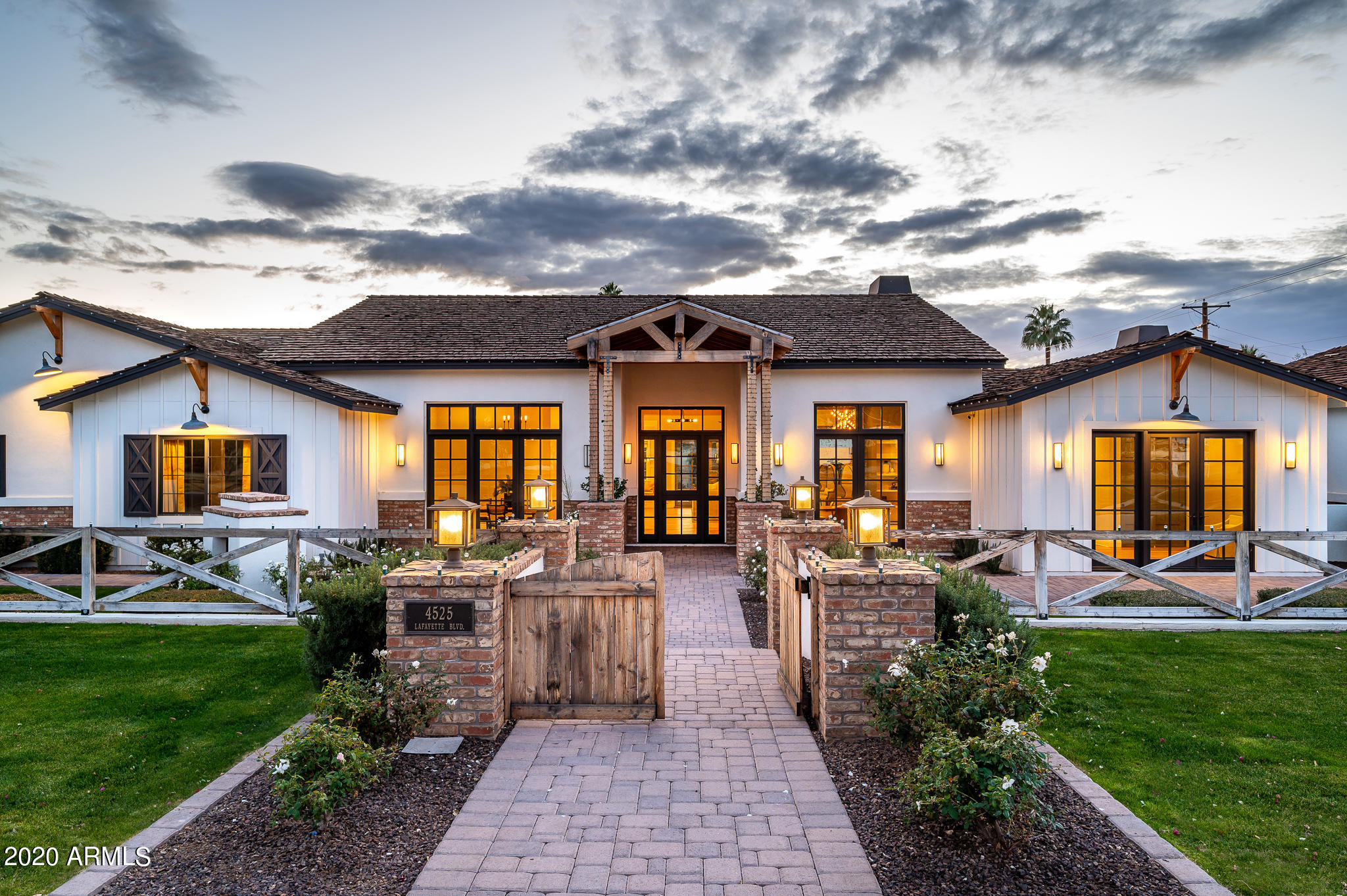 Love where you live in this Modern Arcadia Farmhouse with unspoiled views of Camelback Mountain! Upon entering this home you will be in awe of the floorplan and finishes! The enormous great room is well appointed with soaring ceilings, large brick gas fireplace and a grand wood beam that spans the length of the room. The gourmet chef's kitchen features an impressive marble island workspace, top of the line appliances and walk-in pantry. The formal dining room and private office have dramatic views of Camelback Mountain. The opulent owner's suite is split from the rest of the bedrooms with a fireplace and massive master bathroom featuring large island, huge shower and walk in closet! Lush landscaping, large covered patio and pool create the indoor/outdoor living every homeowner dreams of!!