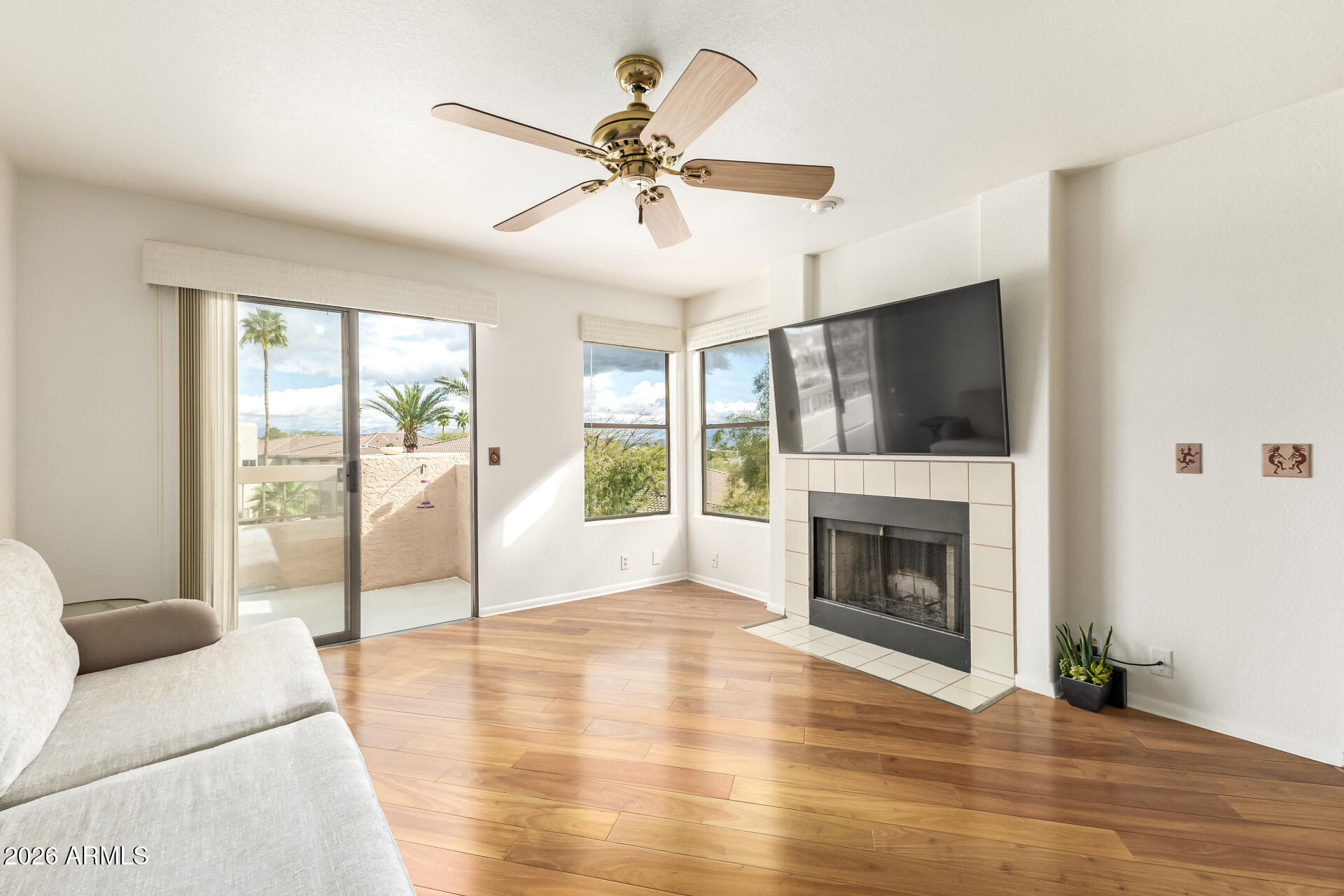 Great property in the heart of Fountain Hills. This large 2 bed 2 bath upstairs unit is perfect for easy living. One of the largest covered patios in the entire complex. Nice hardwood throughout the open floorplan. New AC unit installed in 2023. Located near some amazing hiking, biking, dining, The famous Fountain Park, and some of the best golf around. This is perfect for someone looking for an easy lifestyle or a great lock and leave second home. Must see!!
