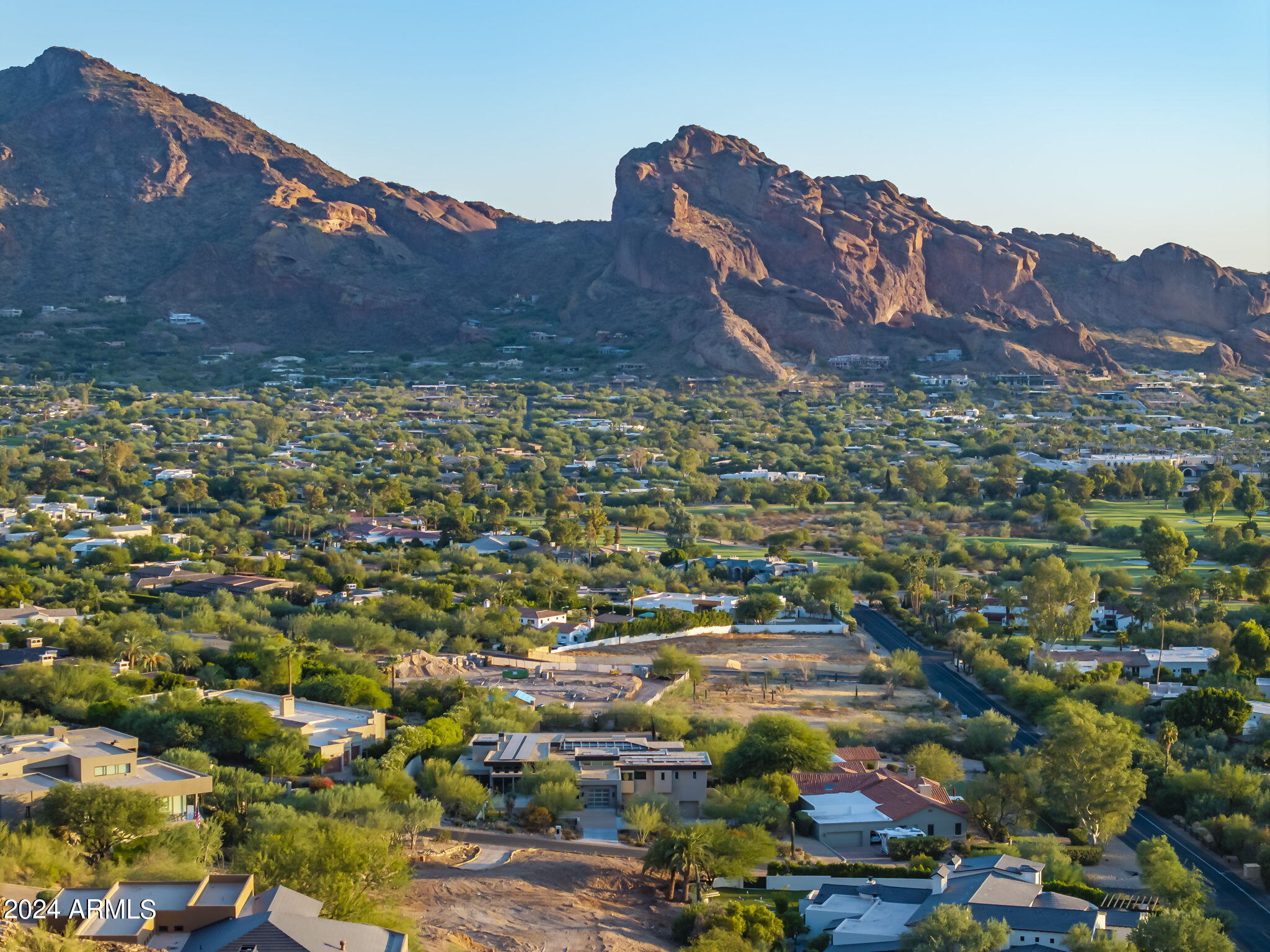 This lot is located in one of the most desirable locations in Paradise Valley. It is located just north and above the Paradise Valley Country Club & within walking distance of the iconic Camelback Inn. This gentle sloping hillside property has sweeping views to the south that capture all of Camelback Mountain as well as Downton Phx & the PVCC golf course. North views look up to untouched desert and the slopes of Mummy Mountain. The site also captures amazing sunsets out over the distant views to the west.